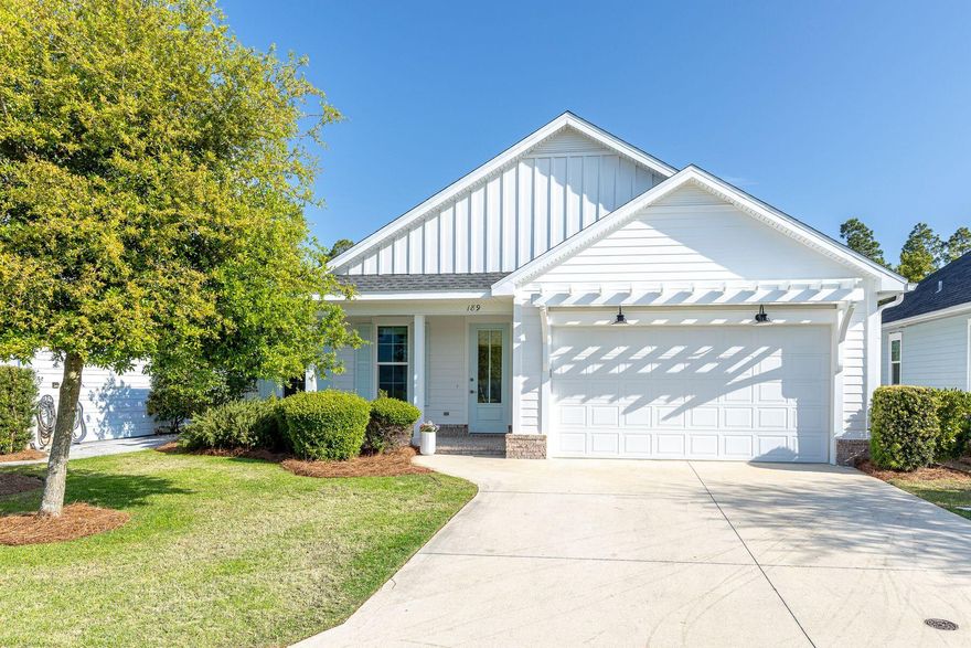 This beautifully maintained home offers effortless one-story living with 3 bedrooms, 2 bathrooms, and an open-concept design enhanced by 9-foot ceilings and abundant natural light. The spacious living area flows seamlessly into a dedicated dining space and a thoughtfully designed kitchen featuring quartz countertops, Bosch stainless steel dishwasher, gas range, and refrigerator perfect for both everyday living and entertaining. The primary suite provides a relaxing retreat, while two additional bedrooms offer generous closet space and flexibility for guests or a home office. Outdoor living is equally inviting. A screened porch with heirloom brick accents overlooks a beautifully maintained, fully fenced backyard. The space is ideal for gatherings, complete with a concrete patio, gas hook-up for grilling, and privacy fencing for added comfort.
Additional highlights include storm-rated windows and doors, a large two car garage, an irrigation system, and a whole-home water shutoff for peace of mind. Located in the highly sought-after Watersound Origins community, residents enjoy close proximity to Village Commons, featuring a resort-style pool and fitness center, as well as tennis and pickleball courts, dock access on Lake Powell, and the renowned Origins Golf Course--recognized by Golf.com as one of the World's 25 Best Par-3 Courses. With its charming character, quality finishes, and thoughtful upgrades, 189 Windrow Way offers an exceptional opportunity to enjoy the best of coastal living in Watersound Origins.