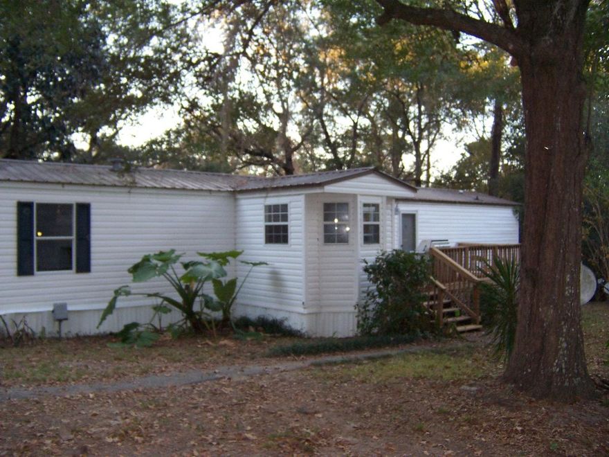 Nice Water front home on a small pond with a lake view of Juniper Lake. Handyman special. Property has tons of potential. Home has front deck ,back porch, Florida room, and lots of charm. Nice country setting with great curb appeal. Newer Metal roof and central HVAC. There is a storage shed and a carport and fenced lot. Paved road frontage. Juniper Lake boat ramp just around the corner and nice park with picnic area just down the street. Will not qualify for traditional financing. Sold as is.