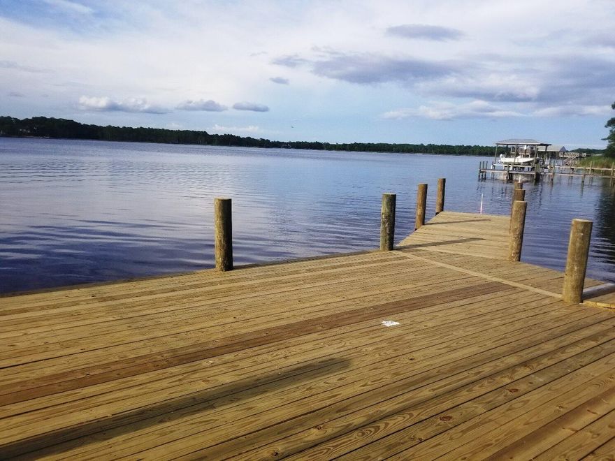 New construction lakefront living at Miller's Landing with direct access to Lake Powell, plus shopping, dining and beautiful beaches all nearby. Gorgeous new construction townhomes will be ready to move in soon with target completion for construction in early April. Miller's Landing is a beautiful, coastal community on Lake Powell minutes from 30A and at a fraction of the price. Enjoy the relaxed lakeside lifestyle of boating, kayaking, fishing or paddle boarding on the lake just steps from your front door.  This premier community features a lakefront pool and a day dock on Lake Powell. The gentle slope adjacent to the day dock is perfect to directly launch your kayak or paddle board easily from the lake shore. For larger watercraft, the public boat ramp is located just one block away.