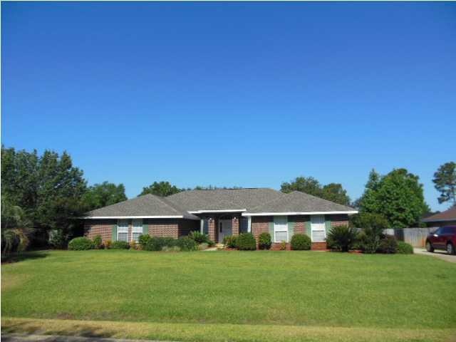 You will love this spacious 4 bedroom, brick home. Gourmet kitchen with center island, custom cabinets and lots of counter space, storage in pantry and laundry room. The family room features vaulted ceilings, French doors and a tiled fireplace. Formal dining room and office/study, master suite with wood flooring, dual vanities, walk-in closet, garden tub/shower combination. There is a heated and cooled Florida room and the additional bedrooms are great sizes. The back yard is fenced and features a large concrete patio, lawn pump and sprinkler system and wonderful oak trees. Absolutely NO Smoking inside home or garage. Sorry, no pets allowed at this home.
