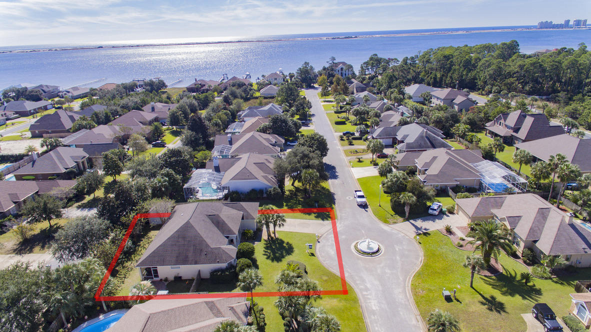 WELCOME HOME to Florida living at its best....This gorgeous custom built 4 bed 2 bath home is located in the Prestigious Water Front lifestyle of La Fontaine.An East Navarre community located on the Santa Rosa Sound~ Homeowners enjoy underground utilities & the common green area with deeded access to the beach and Sound~ Perfect to walk and watch the beautiful sunsets or just sit on the seawall and feel that wonderful Gulf breeze with the best panoramic views over the Santa Rosa Sound and breathtaking views of Santa Rosa Island~Your 2378 sq. ft. home is move in ready ~ Immaculate inside an out ~ideally located within the community overlooking the fountain and boasts lush landscaped front garden with manicured borders ~ Kickback in your peaceful fully fenced back yard beautifully landscaped
