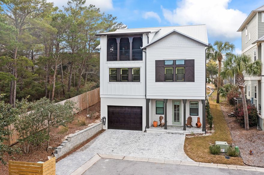 Don't miss this beautiful, new beach home, less than 1/2 mile from the beach! Finished with clean and bright finishes, tons of natural light and a third floor screened in porch surrounded by trees. With 4 bedrooms and 3.5 baths, generously sized 2 car garage and tons of storage. Modern Cafe appliance package in the kitchen, curated lighting fixtures and design details throughout, this house is not to be missed! Perfect for a full time residence or a vacation rental. Village at Blue Mountain is an amenity heavy community including a pool, gym, shuffle board courts, cornhole sets. Additionally, there some incredible commercial additions of Mimmos Italian Ristorante, an ice cream shop as well as a coffee shop and more to come.