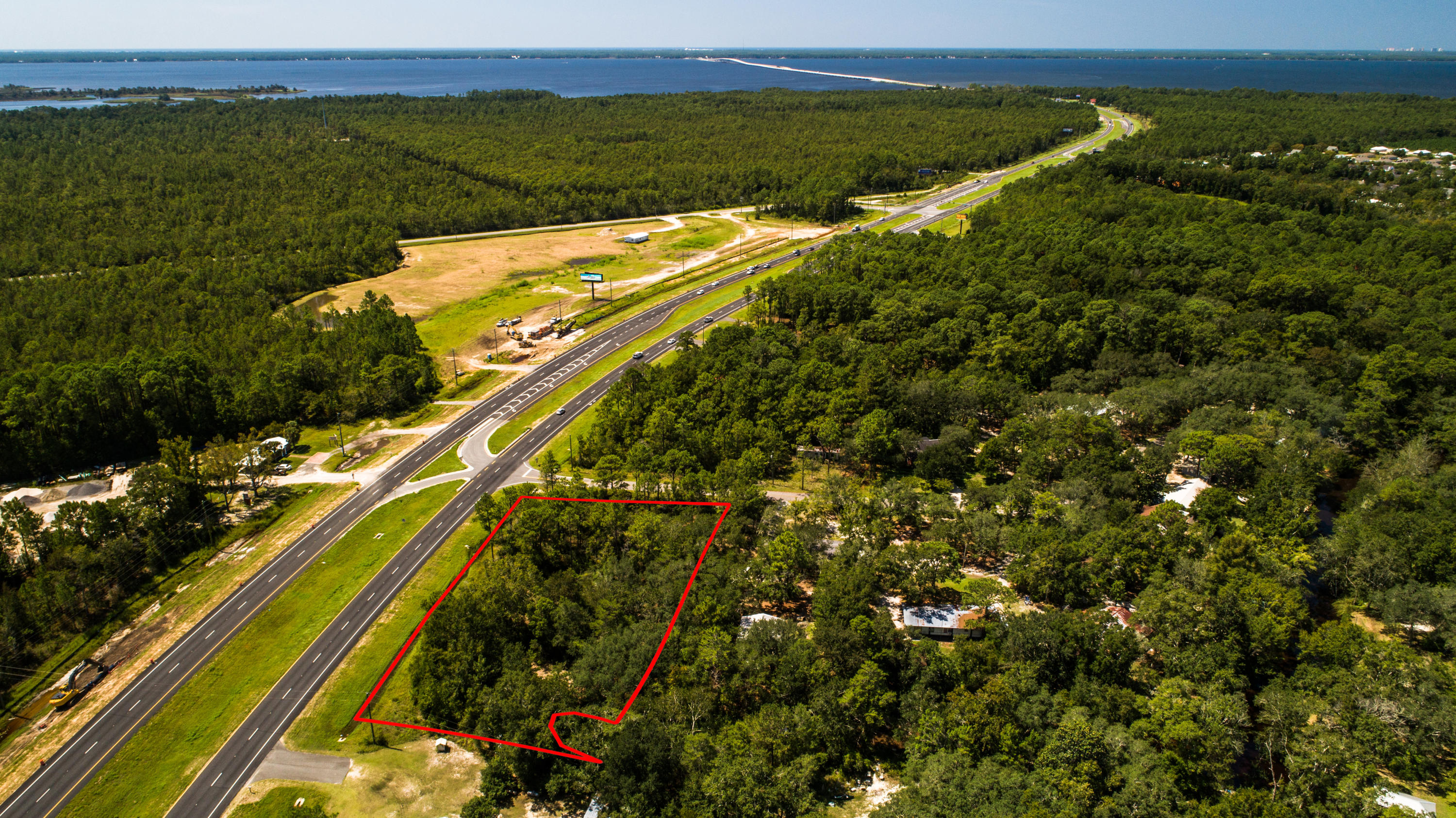 An exceptional opportunity to own 1.86 acres of prime land rezoned to General Commercial. This rectangular parcel ideal for development is strategically positioned on a corner lot with 330 frontage feet on US Highway 331, and should allow approval for access east from Rodney Drive to Hwy. 331. Visit the documents to view the EA report indicating 90% of the site is very good soil/sand for development with no wetlands and a 0-5% slope indicating the subject property is level. This versatile land parcel has immense potential for development into a vibrant retail center or an office complex to serve the adjacent residential communities. BUYER TO INDEPENDENTLY VERIFY ALL INFORMATION.Call listing agent, Deborah Channell at 850.502.9402 for showing.