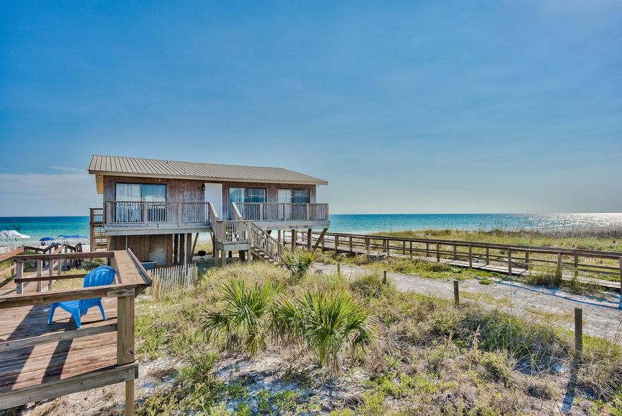 From the Beach deck, you'll have a clear view of Panama City Beach to the east,  Destin & jetties to the west. This property sits as far out on the beach as Any in South Walton County. You will literally be sleeping on sand. The property is being sold as a teardown project, it has simply survived too many hurricanes over 40 years. Seller is in process of permitting new Multi story construction on same pilings. Your input on design will matter. Your new private beach property has deeded ownership of 50 feet of lateral beach down to the *High Tide Line. The nearest public beach accesses are well to the East and west, with a front yard being Oyster Lake, one of 30A's unique dune lakes. This geography creates a truly private beach experience for you and your family.