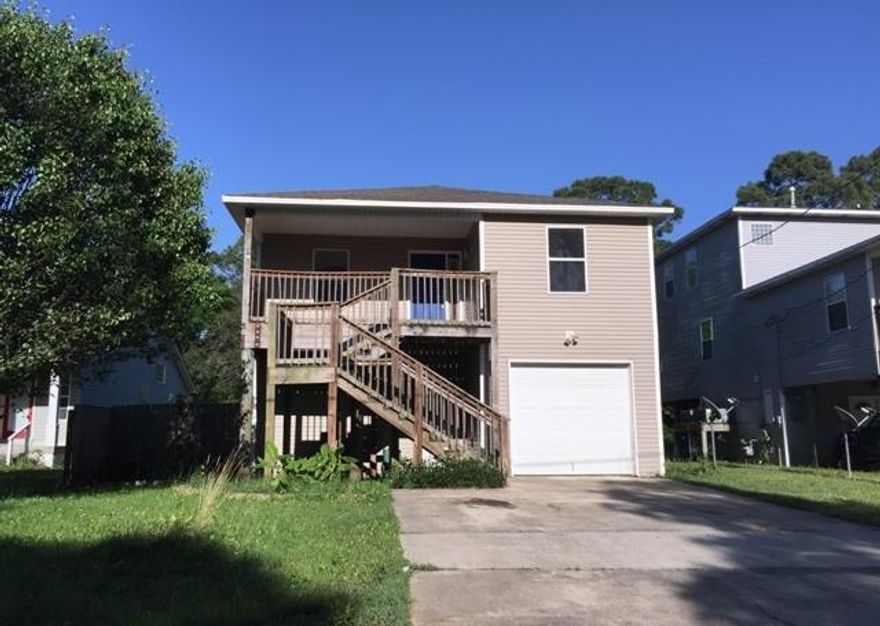 REO ~ Great Opportunity in Niceville...! 4 Bd / 2.5 Ba home with guest quarters. The main living area is on the 2nd floor & offers an open floor with with granite counter tops, custom cabinets & balcony. The guest quarters are located on the 1st floor. With a little TLC, this home has lots of potential for rental investment opportunity.