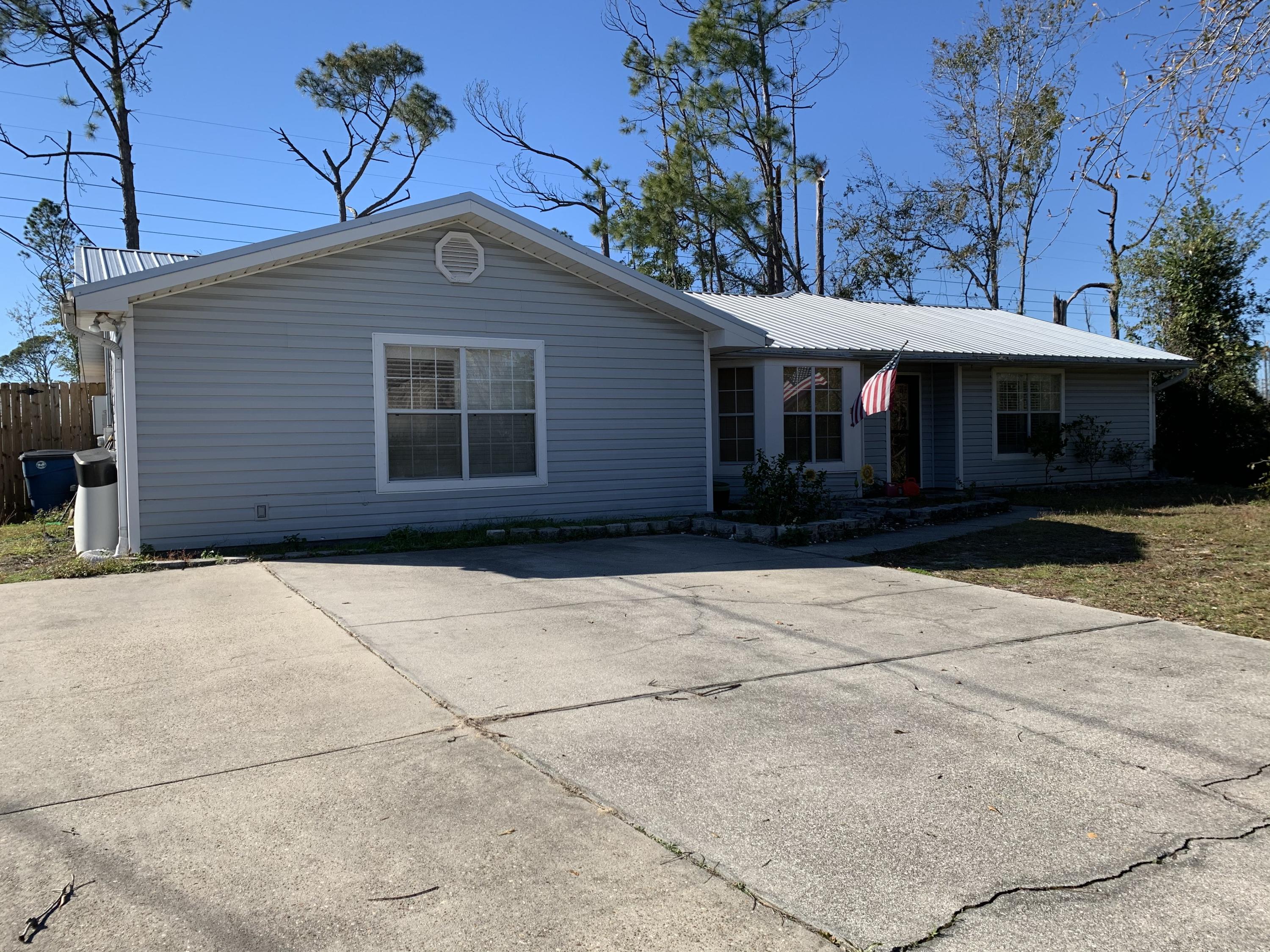 Rare find on a full 5 bed with 3.5 bath home at this price! Home sits on over half an acre with a nice outbuilding (sheet rocked with electric and window unit) and a huge out building with two large roll up doors. The kitchen has been recently updated with granite and newer appliances. Newer lighting throughout. There is a formal dining area as well as a massive walk in pantry area. Built in shelves in the living room. Lots of space inside and out on this centrally located home!