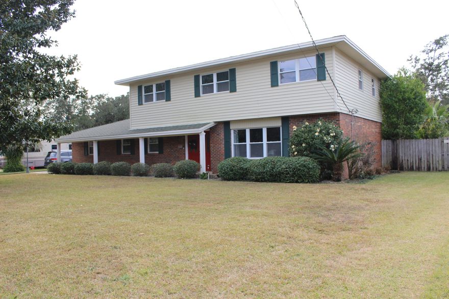 Amazing 4 bedroom 2.5 bath updated family home in Lake Lorraine, Shalimar close to Eglin AFB. Beautiful tree lined street, move in ready home with incredible fenced back yard complete with your own organic garden! Inside you will find a gourmet kitchen with solid surface counters, ample maple cabinets, dining room with gorgeous molding, living room, family room with white fireplace, interior laundry room that has been refigured for maximum space to include bathroom, new office area adds square footage for a myriad of uses- hobby room, play room, hang out room. 4 large bedrooms upstairs with updated baths, including double vanity master bath with tiled shower. The backyard is an oasis with covered patio, organic garden, electric in large shed, upgraded gate with room for an RV or Boat.