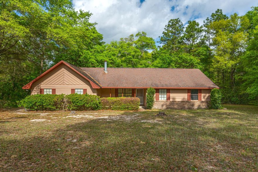 Incredible 2.4 acre lot centrally located in Crestview and a convenient commute to area bases and attractions. A lot of this size located within the city is a tough find! Home is nearly 1400 SF with a 2 car, side entry garage and functional layout/floor plan. Interior features vaulted ceilings in the living room with a bricked floor to ceiling fireplace. Tons of potential with this home with some cosmetic updating! Bathrooms and bedrooms are spacious. HVAC is 2014. Schedule your showing today!