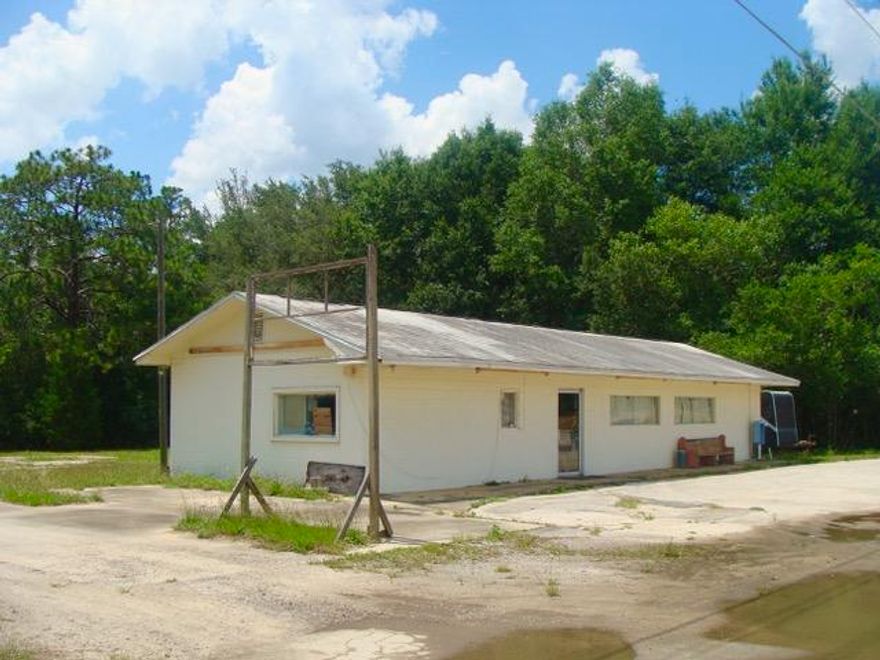 BUSINESS WITH FANTASTIC FRONTAGE ON US HWY 331 -- 1/2 acre parcel and small business on busy Hwy 331-S. This is your opportunity to have a business with 150' of road frontage on the only 4-lane highway between DeFuniak Springs and the Beaches of South Walton. Thousands of tourists & locals travel this roadway daily and your business could own a piece of the action! Zoned Commercial. Property is currently used as an upholstery shop, but offers lots of options for other businesses. Inside has 2,000 sq. ft., a half bath and central heat & air. Lots of parking in front, side and rear. Large metal storage building included. Don't let this one get away! All dimensions, square footage & suitability for intended use to be determined by buyer at buyer expense.