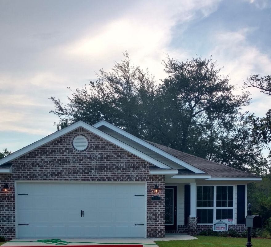 Very appealing and beautifully decorated home centrally located to Milton and Pace.  Easy access to Interstate 10 and then across the bay to Pensacola! You will love this quiet, well maintained neighborhood with no through traffic.  The home has many special touches and looks brand new.!  Many upgrades include all new lighting and ceiling fans as well as tile backslash in kitchen, at breakfast bar kick space and master bathroom.  Third bedroom is currently used as a craft room.  Move in ready and and available at closing. Covered patio and stately oak tree add charm to this picture perfect home! Community owned undeveloped corner lot adjacent to property and greenbelt at the back lot line provide added privacy. Call today for appointment!