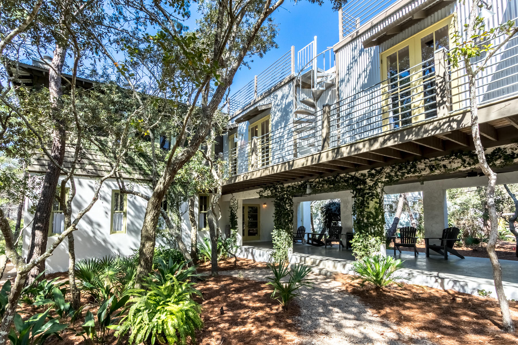 Gulf coast and lake life combined in Grayton Beach can be found on the streets of Wilderness Way. Well developed scenic neighborhood south of 30A on beautiful Western Lake. This home was a cover story and 10 page article in Better Homes and Gardens in 2004 for unique design by renowned architect Carey McWhorter. This 4 bedroom sits on a coastal dune lake with private dock providing quick access via kayak, paddle board or small outboard boat. The home is a unique blend of modern, industrial and cottage. Featuring an open yet functional layout with ample outdoor living space. The home boasts over 2900 square feet of indoor living space, connecting 2 car garage, loggia, screened in porch over looking the dune lake with multiple elevated viewing porches and roof top deck via spiral staircase. The private dock on Western lake leads to the beaches from a walkway off large screened in porch on first floor with private outdoor shower. The perfect way to freshen up after  fabulous play day in the sand. The views of Western lake can be seen from both floors and the soothing sounds of gulf waves can be heard from the open indoor/outdoor living. This home is a must see in the coveted exclusive neighborhood of Lakeplace at Grayton Beach. This gated low density neighborhood is rent restricted and amenities include neighborhood pool and large community dock.***Buyer is responsible for personally verifying details about this property. Any information contained in this listing is believed to be accurate but is not guaranteed.***