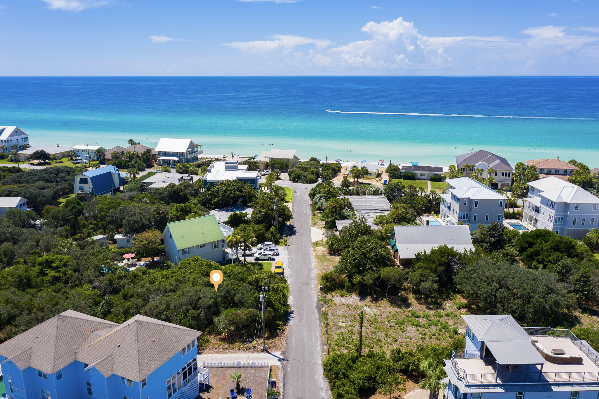 Build your beach home on this large vacant parcel in Blue Mountain Beach, steps away from a deeded beach access at the end of the road. Gulf views possible with a multi-level home. This property is dry, flat, and at a high elevation. The size is 75' x 150' just over a quarter acre. No HOA dues or buildout times. This lot is West facing, which provides the ability to watch the beautiful sunsets. You will also enjoy the sounds of the waves crashing from your own home. Blue Mountain Beach is a charming area and very popular for full time residents, second homes, and income producing properties. Grayton state park is nearby containing miles of trails for biking and hiking. The great new restaurant, Blue Mabel, is within a short walk or easy bike ride. In addition, the Blue Mountain Creamery,