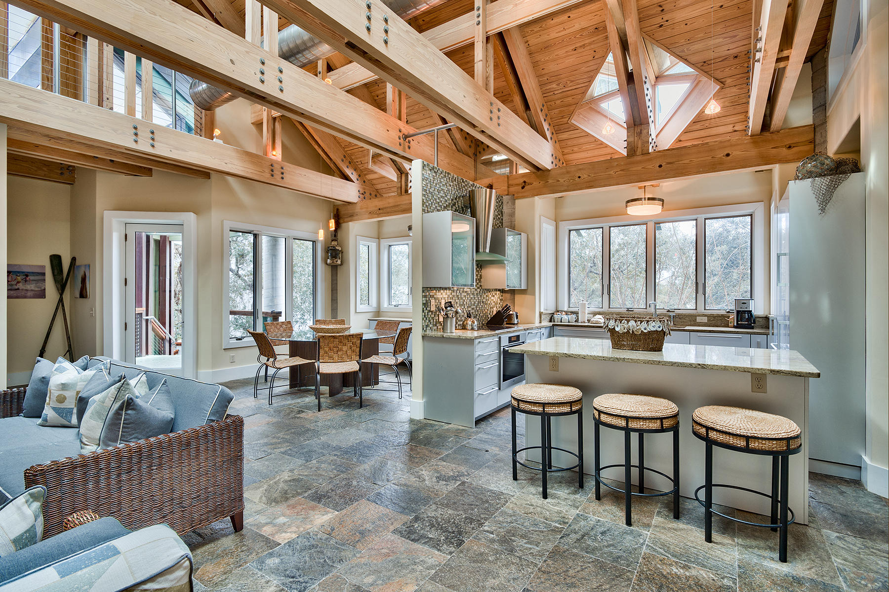 Here is a rare opportunity to own an extraordinary 2,634 square foot home that exudes beauty and Zen-style modern living with sought-after architectural design by renowned architect Russell Johnson and custom built by Don Purdie. This 3 bedroom, 3 and one half bath residence is unlike anything you have seen before, where every room makes a statement. With a careful display of windows, skylights and invisible mirrors, this property brings the outdoors, inside. Opening to a spacious great room with exposed stainless duct work and custom fabricated trusses that draws the eyes upward to the skylights in the vaulted ceiling, this magnificent space includes floor to ceiling built in bookshelves, stone flooring, all bathed in popular color schemes.