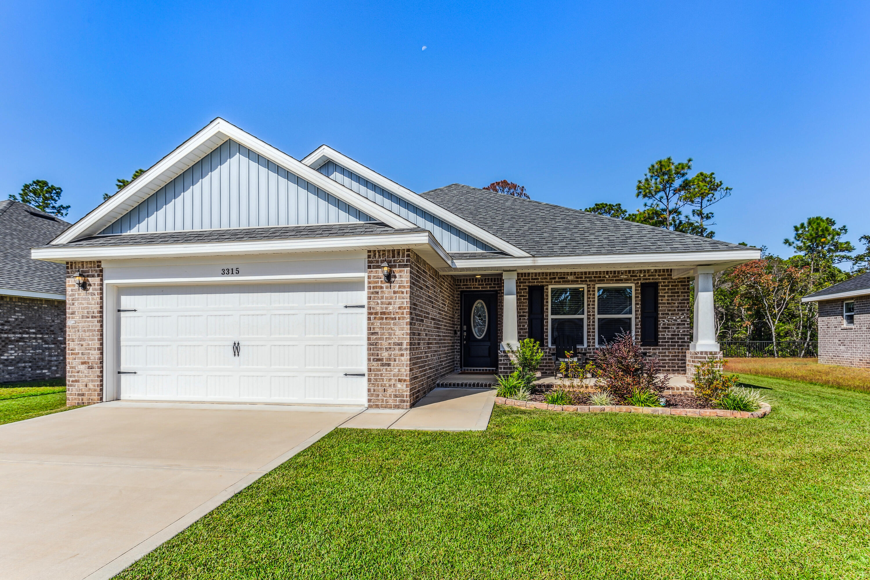 Experience the ''most secluded neighborhood in Navarre'', Secret Isle Estates. Where a serene natural preserve ensures no future developments behind your home. This all-brick home, built and purchased in July 2023, offers a rare opportunity for luxury and privacy. Lightly lived in due to job relocation, it's a must-see for those seeking a quiet, well-lit neighborhood with sidewalks and a peaceful atmosphere. The 'Carlos' floor plan features 3 bedrooms, 2 baths, and a spacious living area with vaulted ceilings, perfect for relaxed family living. Scratch and water-resistant luxury vinyl plank flooring flows throughout the main living areas, adding both durability and elegance. The kitchen is a chef's dream with stainless steel appliances, granite countertops, soft-close cabinets and drawers, bar seating, and brushed nickel hardware. The grand master suite is a true retreat, featuring vaulted ceilings, two walk-in closets, a garden tub, a separate tiled shower, and double vanities. Outside, enjoy the convenience of a newly installed irrigation system, cozy hot tub, and it even includes fabric shield hurricane shutters that cover all windows and doors. ALL Furnishings are negotiable and can convey with the purchase. Located just off Hwy 87, Secret Isle is minutes from shopping, dining, top-rated schools, and the pristine white sands of Navarre Beach. Don't miss out on this one-of-a-kind opportunity to live in Navarre's most secluded neighborhood! Call today for more details. 