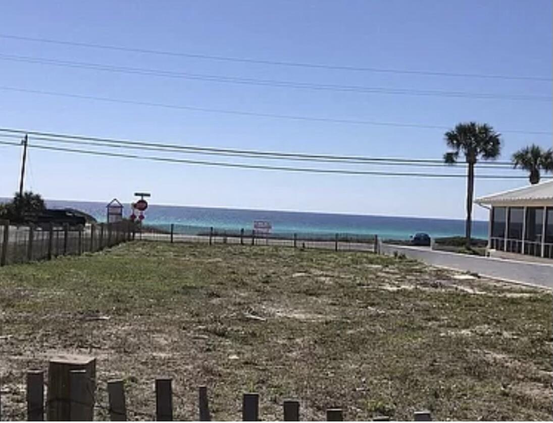 Deep corner lot with perpetual Gulf views and direct beach access. Parcel is zoned C-2, Plaza Commercial. The lot is 50 feet wide and 145 feet deep. Could be developed as a residential rental property or one of the following commercial uses, per the current Land Development Regulation: Retail, convenience store, gas station, restaurant, drug store, laundry, day care, florist, clothing, auto parts, package store, bed and breakfast, financial, professional office, health care. The undeveloped 11-acre parcel across the street is privately owned but is zoned for recreational use only,