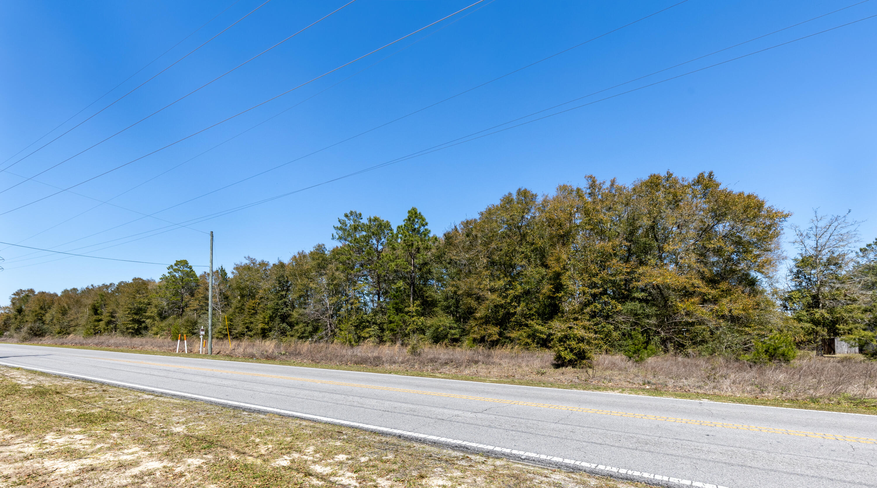 Prime 1.385-Acre Homesite in DeFuniak Springs - Zoned R-1 Single-Family ResidentialSeize this exceptional opportunity to own 1.385 acres of prime land on Walton Road, conveniently located less than a mile from Walton High School in the charming town of DeFuniak Springs, FL. This residentially zoned (R-1) parcel is prepped with water and sewer installed (tap fee due), making it a ready-to-build site for your dream home.Located in Flood Zone X with no wetlands, as per Walton County GIS maps, this property offers peace of mind and ease of development in a serene yet highly accessible location--just minutes from shopping, dining, medical facilities, and schools, and less than 50 minutes from the stunning beaches of 30A.Why You'll Love This Location: DeFuniak Springs Highlights:
Lake DeFuniak - One of only two nearly perfect circular spring-fed lakes in the world (40 acres), with a scenic walking trail, dock, and seasonal public swimming and fishing.
Historic Downtown District - Less than one mile away, featuring the famous Chautauqua Building, charming shops, and community events.
Annual Christmas Lights Festival - Showcasing over 10 million lights around the Lake Yard, attracting visitors from across the region.
Outdoor & Recreation:
King's Lake - A well-stocked 580-acre reservoir just 6.3 miles north, perfect for fishing enthusiasts (record bass catch: 17.25 lbs!).
Gulf of Mexico's White Sand Beaches - Access pristine beaches within 35 minutes to an hour, including Henderson Beach, Miramar Beach, Santa Rosa Beach, and more.
Crab Island in Destin - A world-famous boating destination on the Emerald Coast.
Emerald Coast Zoo & Chautauqua Winery - Local attractions perfect for family outings.
Endless Outdoor Adventures:
Multiple hiking trails including Florida Trail (Eglin & Nokuse), Lakewood Park, and Lafayette Creek.
Natural Springs & Parks - Explore Vortex Springs, Ponce De Leon Springs, Morrison Springs, and Florida Caverns in Marianna.
Key Features:
*1.385 acres - Zoned R-1 for single-family residential
* Water & sewer installed (tap fee due)
*Flood Zone X - No wetlands (per Walton County GIS maps)
* Minutes to downtown DeFuniak Springs & shopping
*Less than 50 minutes to the beaches of 30A
*Close to fishing, boating, hiking, and natural springs
This rare homesite blends convenience, nature, and lifestyle in one of Florida's most charming communities. Don't miss your chance to own a piece of DeFuniak Springs - schedule a visit today!
Buyers are responsible for verifying all property details and dimensions. Information is believed to be accurate but is not guaranteed.