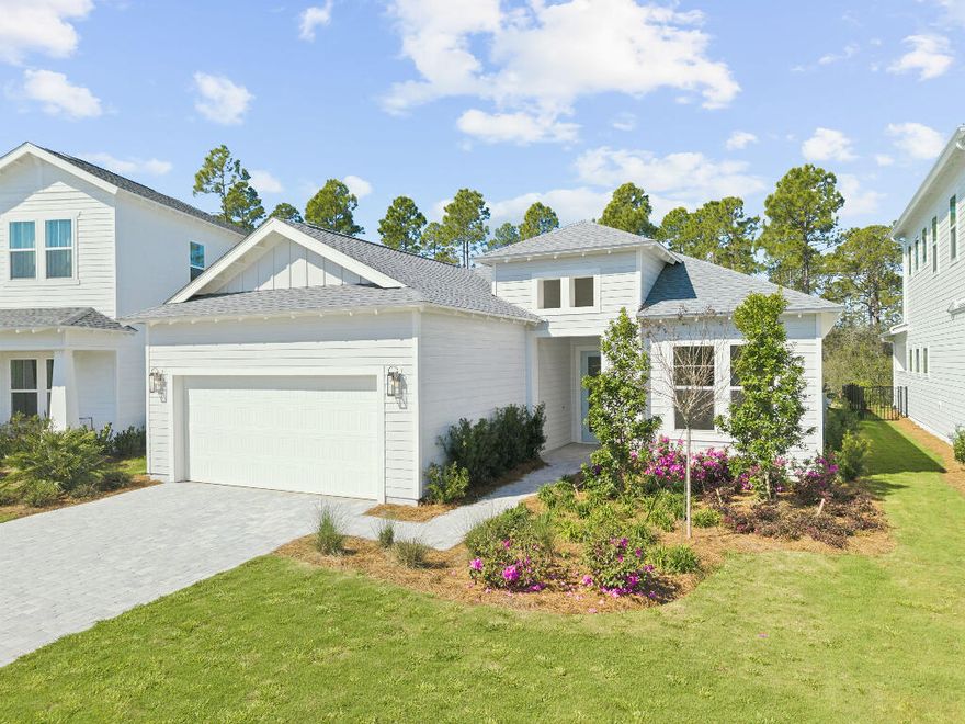 This stunning 3-bedroom, 3-bathroom home with a private office is located on the highly desirable Orman Court cul-de-sac within the gated NatureWalk at Watersound Origins community.  Situated on a premium lot that backs up to picturesque evergreens, the property offers exceptional privacy and year-round sunset views.  This popular Marco floorplan by Kolter Homes features a spacious, open-concept design.  The great room and dining area flow seamlessly into a gourmet kitchen, which serves as a culinary dream with expansive upgraded quartz countertops, a large island, a porcelain farmhouse sink, and an extended gas cooktop.  High-end finishes include timeless white subway tile, an upgraded exhaust vent, stainless steel appliances, and a walk-in pantry.  Each bedroom includes an ensuite bathroom featuring upgraded cabinetry, porcelain tile to the ceiling, and a walk-in closet.  The living area opens through wall-to-wall glass doors and windows to a substantial screened lanai overlooking the forest.  The oversized lot provides ample space for a luxury pool and spa, and already includes plumbing for an outdoor hot/cold shower.  Residents enjoy world-class community amenities, including a fitness facility, pool, spa, tennis and pickleball courts, a par-3 golf course, and nearby public beach access. This new construction home offers the ultimate coastal lifestyle and is move in ready!