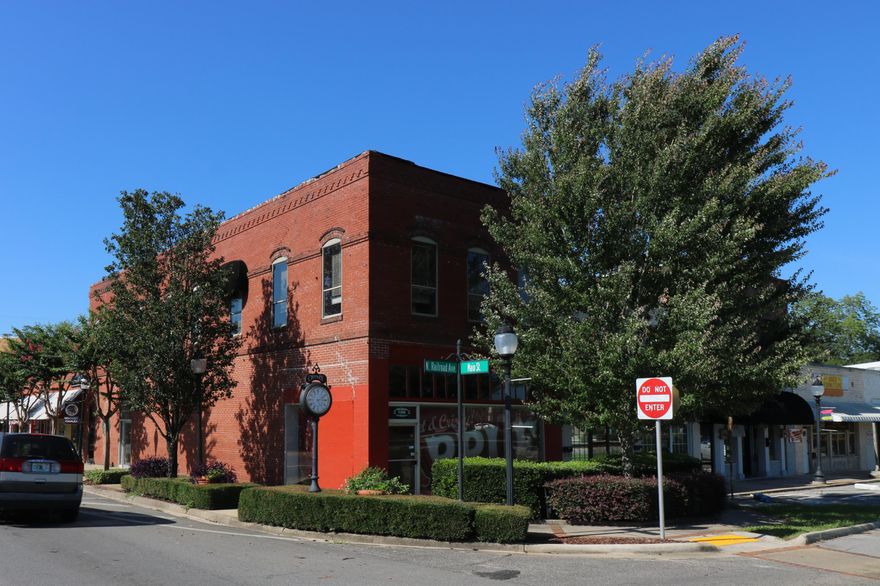 Steel of a deal downtown! This 4000 sqft building qualifies for several historical improvement/renovation grants. The owner can live upstairs or because of the recent approval of downtown living, with fire code qualifications met, they can rent out the upstairs for tenant living spaces! Downstairs has been partially renovated with new electrical, drywall, and ceilings. Building has 2 ac units. Upstairs has been cleared to the studs as the owner was going to make 2 residential units. Great location on the corner of Main ST and Railroad Ave. Only 2.5 miles to Interstate 10 and within approximately 45 miles to the international airport and sugar white beaches of Panama City Beach.