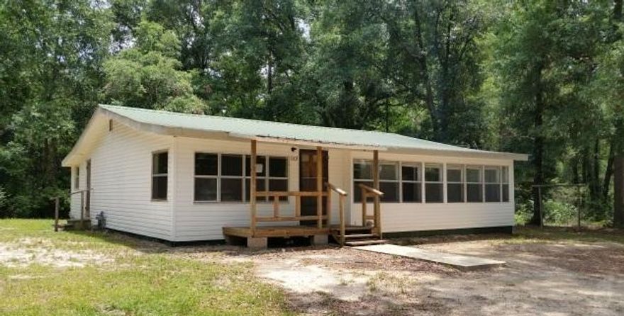 REO This is .83 of an acre not far from the town of Florala. With some TLC this would make a great family home. Large kitchen with open dining area and living room with Florida room on the front of the home. Genuine hardwood floors in bedrooms. Great back yard with enough room for the play set or above ground pool.