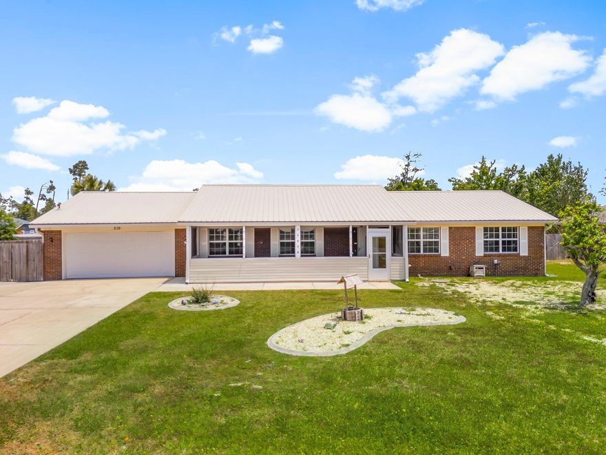 Welcome to this beautifully maintained 3-bedroom, 2-bathroom brick home situated on a generous lot that offers both space and privacy--with no HOA and no lender-required flood insurance for added peace of mind. With a 2-car garage complete with built-in shelving, this property is perfect for families, hobbyists, or anyone looking for room to grow. Step inside to find a large living room with a cozy wood-burning fireplace, ideal for relaxing evenings. The updated kitchen features an abundance of wood cabinetry, a breakfast nook, breakfast bar, and an eat-in dining area--perfect for entertaining or casual family meals. All three bedrooms are oversized, providing plenty of room for rest and relaxation. You'll also enjoy the convenience of a spacious laundry room with additional cabinetry.