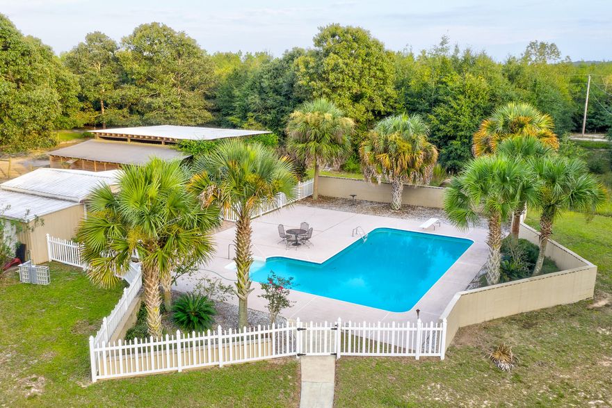 Do you want to ride your horses or swim in the gorgeous pool today? This beautiful country home has it all. Large family room and good sized bedrooms are also a plus. The Living room looks out onto the huge covered front porch which is the length of the home. Stables are large enough for 2 horses and plenty of room for hay & feed. Excellent property in good location. RV hook up & lots of space for your beautiful ponies. Whats not to love? Minutes from Interstate 10. Great opportunity for country living!