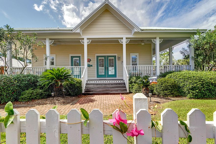 4 Seater Club Car golf cart included! Step up onto the wraparound porch of this quintessential Florida cottage and be transported to a simpler time. Patio doors lead from the porch to the large open plan kitchen, dining and living area that is the perfect spot for gathering and entertaining. This area offers a vaulted ceiling, adding to the feeling of space, and the updated kitchen is finished with granite counter tops and stainless steel appliances. The home features a master bedroom with en-suite bathroom and a spacious guest bedroom with access to a second bathroom. The home also features plantation shutters and wood flooring throughout. There is a separate laundry and a carport with plenty of storage. Crystal Lake owners enjoy a lovely lakefront pool and all the amenities of Sandestin.
