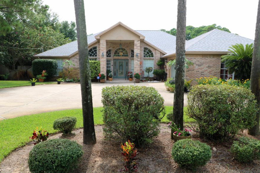 Beautiful & well maintained home just 2 miles west of Hurlburt's Main Gate! You'll love this all-brick, 3 Bd/2Ba/ 2cg home from the minute you pull into the over sized, beautifully landscaped circular driveway. You will enter the home to find vaulted ceilings & an open floor plan perfect for entertaining. There is an office off the entry that has French doors to the living room & a closet for storage. The formal dining room is opposite to the office & has access to the kitchen. The great room has cathedral ceilings, a gas or wood-burning fireplace w/built-in storage for your logs. The great room leads to the sun room that is almost 400 sq. ft, heated & cooled, has blinds for privacy, has access to the guest bathroom, & 2 doors that lead to the backyard making it great for year round use.