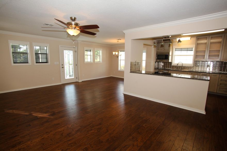 Luxury and space await you in this recently remodeled home. This home features brand new paint, hardwood flooring, carpeting, light fixtures, and fans throughout. The kitchen also features new stainless steel appliances, ultra modern cabinets and stainless steel backsplash. It will be a pleasure to cook in this kitchen. All bathrooms have undergone numerous upgrades as well. The stainless steel railing leads to a split stairway with one leading to master bedroom suite and the other to a bedroom/office/family room space or whatever your needs are. Emerald Lakes is a wonderful, highly desirable gated community that includes pool, tennis, playground, and more amenities. Home backs to the Emerald Bay Raven Golf Course. HOME IS LOCATED IN COBRA ZONE. ONLY CONVENTIONAL FINANCING OR CASH OFFER