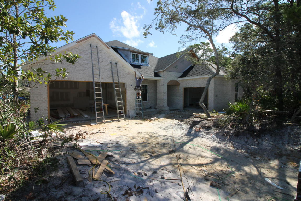 Stunning 5 bedroom 4 bath home with a media room and 3 car garage in one of the most prestigious neighborhoods in Panama City Beach. This home offers Custom wood cabinets, granite Counter tops, up graded light fixtures, tile floors, and has an open floor plan. It opens up to a Huge Covered Lani in the back just perfect for entertaining. This home is in a gated community on Panama City Beach Close to Golf Courses, Shopping, Boating, all the activities you Love about Panama City Beach. Don't miss this new construction going up right now!