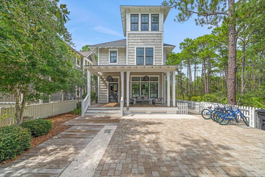 Without question this home boasts the Premier lot location within the exclusive gated community of Watersound West Beach. A mere 1000 feet from your front porch across the private community boardwalk to put your toes in the sand and enjoy the fabulous Emerald Coast Beach. Nestled beside the natural beauty and privacy offered of Deer Lake State park allowing you to fully enjoy the outdoor grilling and dining area. Perhaps take a stroll or bike ride on one of the many boardwalks accessible just outside your doorstep Directly in front of the home lies the luxury community pool and clubhouse enabling you and your guests quick access as well as the ability to keep an eye on young ones swimming without leaving the home. Entering the home you will blown away with the natural light and open of this well designed beach home. The main floor features a large thoughtfully decorated living area with ample seating and soothing views of the park. The dining area offers an oversize table with seating for 6. The chefs kitchen features a large newly updated marble island with bar stool seating, Viking Range and Refrigerator and ample counter space and cabinetry. Just off the back porch you will find the tastefully designed "mud room" with built in cabinetry and shiplap wall treatment, a gorgeous full bath with shower, the laundry and separate oversize storage area under the stairs. For those looking to work from home you will find the perfect built in office space tucked behind the staircase leading up from the entryway. On the middle floor you will find two beautifully decorated guest bedrooms, one with ensuite bath, a hall bath, a built in day bed and the primary bedroom offering expansive windows with views to the community pool and state park and spa like primary bath with soaking tub and separate shower. The intricate use of shiplap as well as board and bat wall treatments throughout these spaces gives a high end yet warm feel to the design. The third floor showcases a relaxing gathering space with vault ceiling and oversize windows offering the very best views. A uniquely designed bunkroom offers guests a chance  to sleep in after a long day at the beach or kids a hideaway to enjoy playing video games.
Watersound West Beach located on the coveted east end of 30A with its gated privacy, deeded beach, adjacent to Deer lake state park and featuring walking trails, oversize community pool and a putting green will fulfill your beach home dreams. Ask for a private tour today.