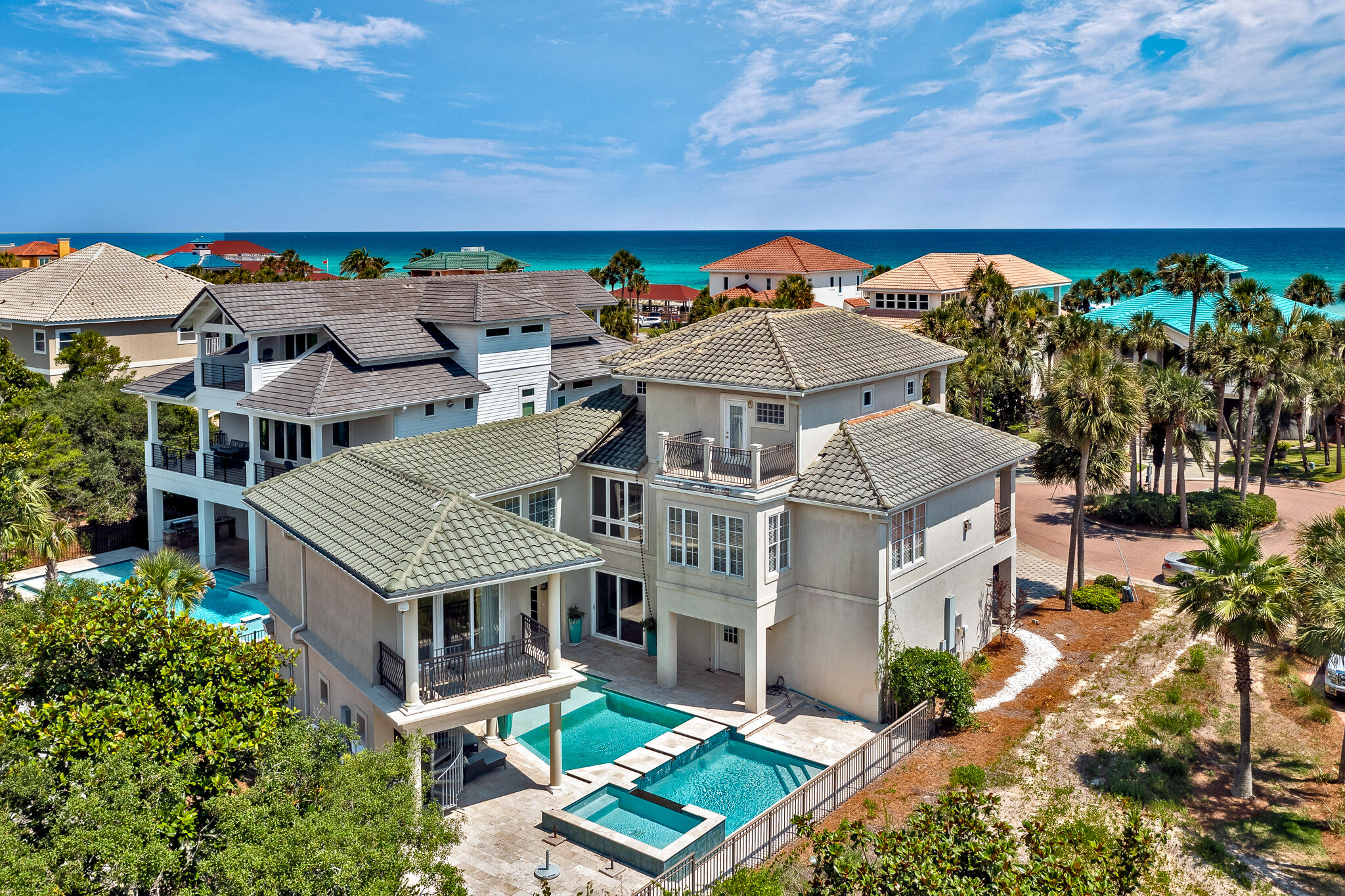 Destiny (West) is across the street from the white sandy beaches of the Gulf of Mexico.  Home is just inside the gate  considered second tier. Make yourself comfortable in this spacious 5 bedroom, 5 bath, fully furnished 3895 Sq. Ft. home with eclectic but stylish decor.  Enjoy the benefits of having your own private pool and covered outdoor kitchen, gas grill,  fireplace, and 2 TVs or use the clubhouse with a community pool, exercise room and tennis courts. Ground level you will find the inviting foyer with a lovely view of the pool, and one guest room plus a Media/bonus room. Home has a spacious, open living area with fireplace, large kitchen with banquette table and dining area, plus a large adjoining balcony on the second level. The spacious primary bedroom and bath, second guest and bunk room are also on the second level. The 5th bedroom and bath suite you will find on the third level with private balcony, and a separate sitting area just outside the bedroom door. This lovely home would be a great investment property, second home or primary residence. Destiny (West) truly is a piece of paradise. Come enjoy the sun, the white sugar sand and beautiful turquoise water on the Emerald Coast. Long list of improvement under documents