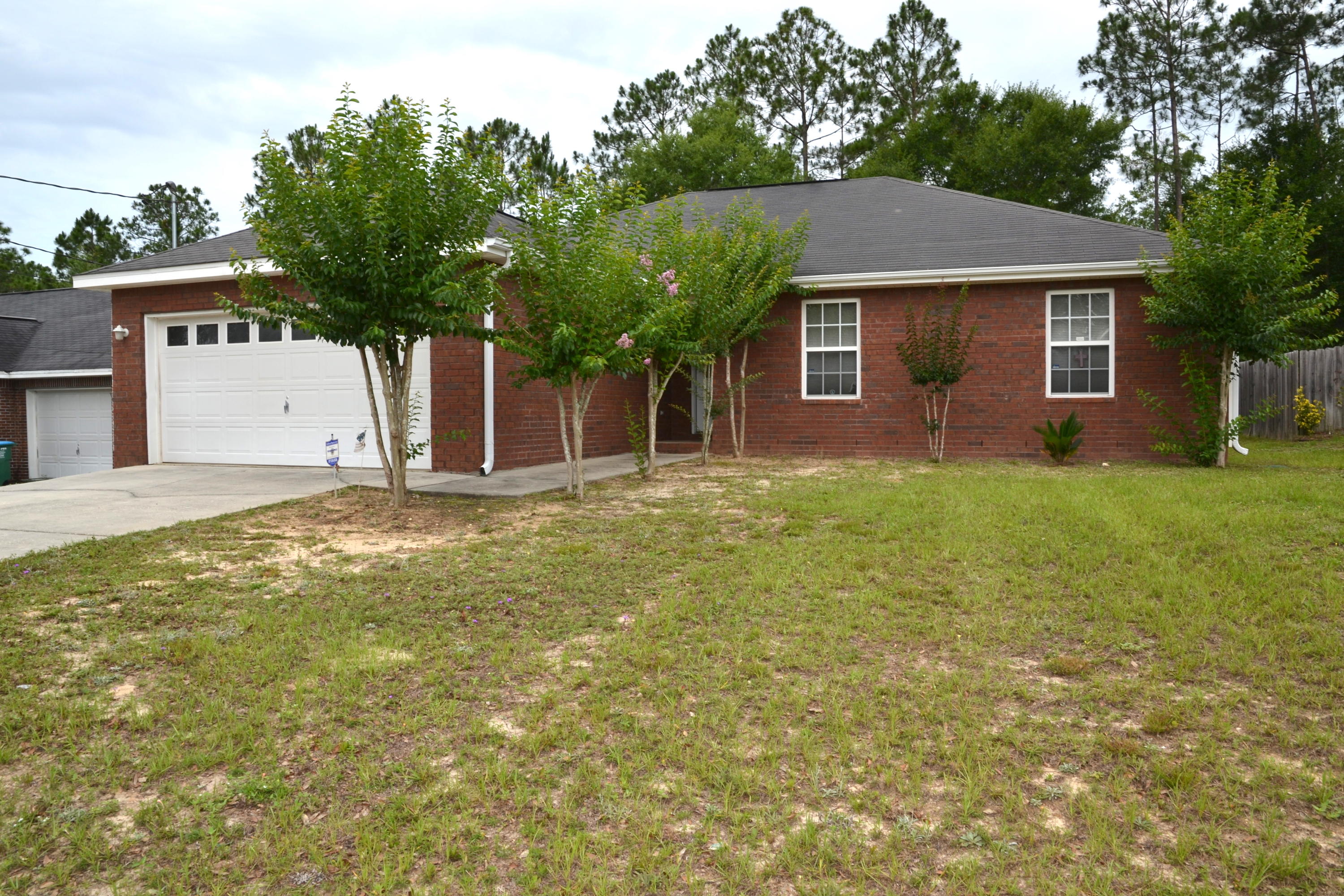 Ready for the New Owner! One owner home is offered w/a 1 YR Home Warranty and help w/most of your CLOSING COSTS! Split Bedroom floor plan offers 4 Bedrooms, 2 Bathrooms, Living Room w/Fireplace, Tons of Closet Space, and a LEVEL Back Yard! Master Suite is located off the Dinning Room and the Master Bath Features: double vanity, separate shower, Garden Tub, and walk-in-closet. Laundry Room is off the Kitchen and is equipped with a pantry and access to the 2 Car Garage. Convenient location to Walker Elementary School and Hwy 90 East. Home Warranty $400 value. Closing Costs assistance provided by seller do not include: credit report, inspections, 1st year homeowners insurance, escrow account set up, prepaid interest. Schedule a Viewing TODAY!