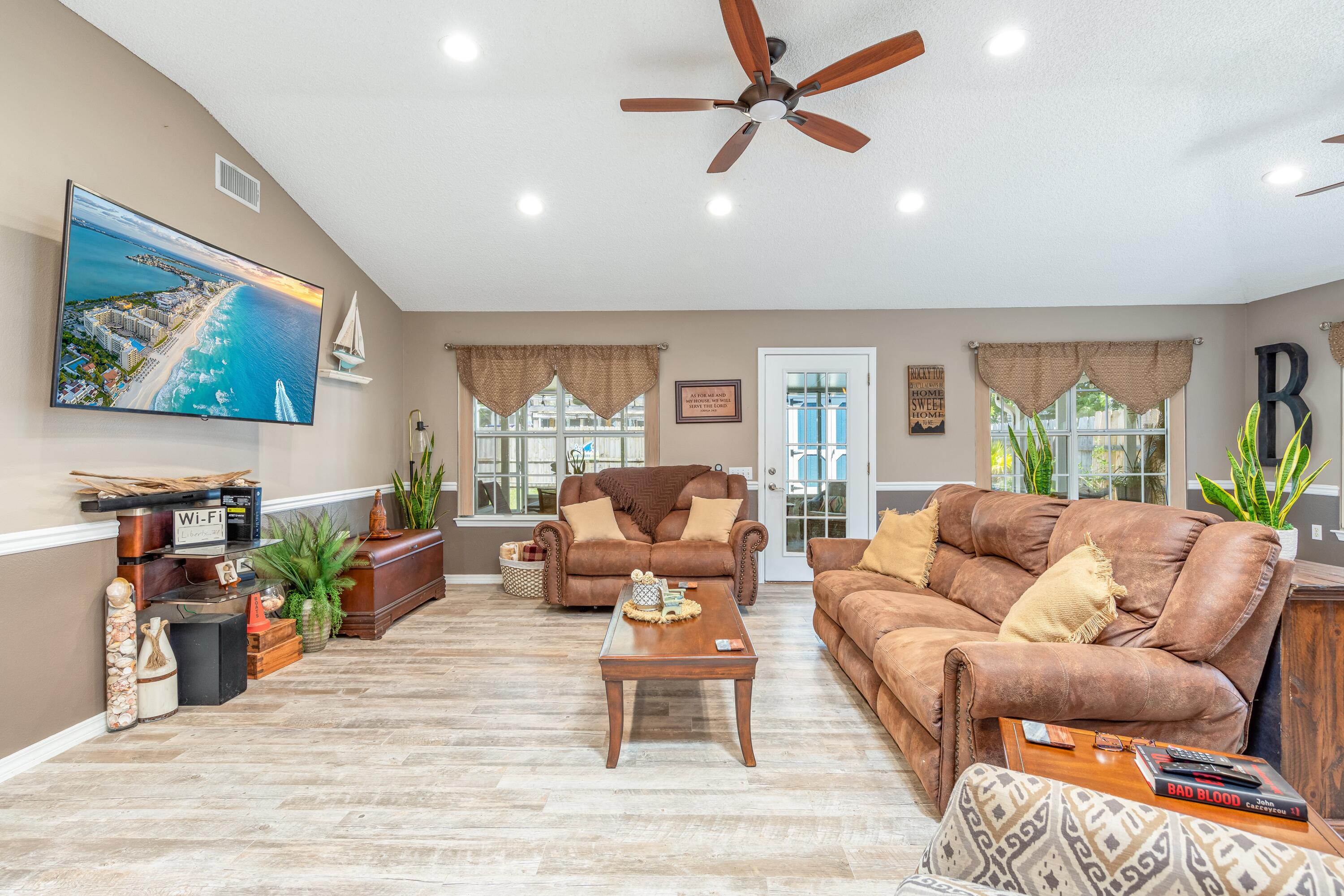 Waterfront community! This home offer an inviting open concept floor plan, wood grain tile floors in the main areas and outside patio. Updated lighting and fans throughout. Custom stone backsplash in the kitchen, granite counter tops in the kitchen and on the bathroom vanities. The primary suite has an over sized walk-in closet and the bathroom has a double vanity with a garden tub and separate walk-in shower. The outside cover patio is perfect for entertaining or relaxation. Recent installed water heater, (December 2021) and less than a year old build shed for extra storage or workshop. Lighthouse Point community offers two neighborhood parks, deeded sound access, firepit, and picnic area. Great place to kayak, paddle board, or simply watch the sunset.