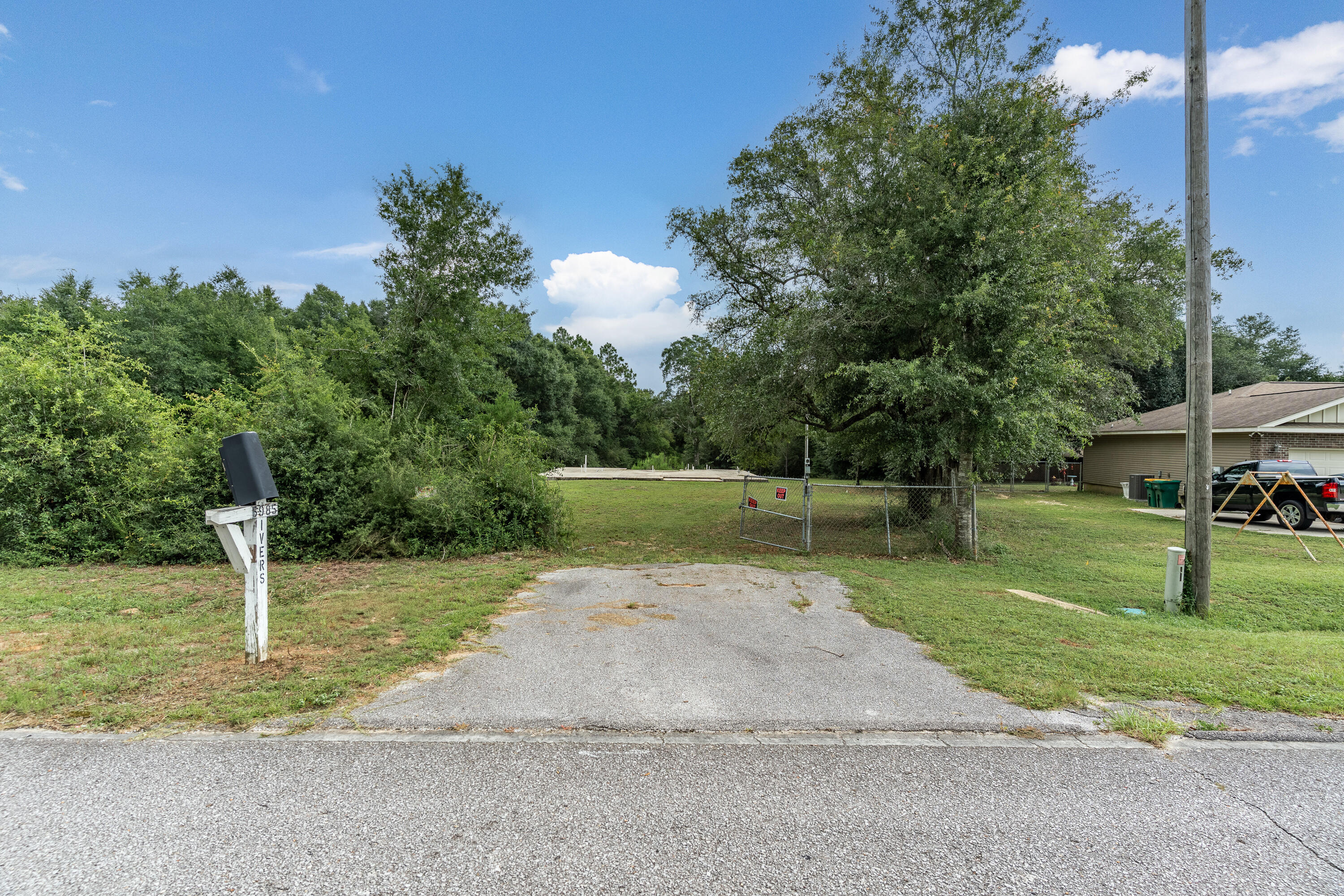 This 1.94-acre parcel offers a rare opportunity to build your dream home with a significant head start. The foundation has already been poured, and rough-in plumbing is in place, saving you time and expense. Ideally located less than three miles from grocery stores and shopping, the property still offers a peaceful, natural setting with deer often seen in the backyard. The lot is mostly enclosed with a chain-link fence and offers the potential to subdivide and build two homes. The water tap fee has been paid, and a temporary power pole is installed and ready for connection. Additionally, the seller is including an engineered set of plans for a spacious 5-bedroom, 3-bathroom home. The existing slab was inspected and approved by the county building inspector in April 2025, making this property a truly build-ready opportunity.