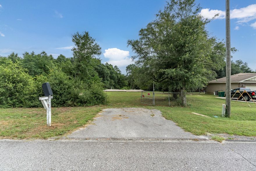 This 1.94-acre parcel offers a rare opportunity to build your dream home with a significant head start. The foundation has already been poured, and rough-in plumbing is in place, saving you time and expense. Ideally located less than three miles from grocery stores and shopping, the property still offers a peaceful, natural setting with deer often seen in the backyard. The lot is mostly enclosed with a chain-link fence and offers the potential to subdivide and build two homes. The water tap fee has been paid, and a temporary power pole is installed and ready for connection. Additionally, the seller is including an engineered set of plans for a spacious 5-bedroom, 3-bathroom home. The existing slab was inspected and approved by an engineer in April 2025, making this  property a truly build-ready opportunity.