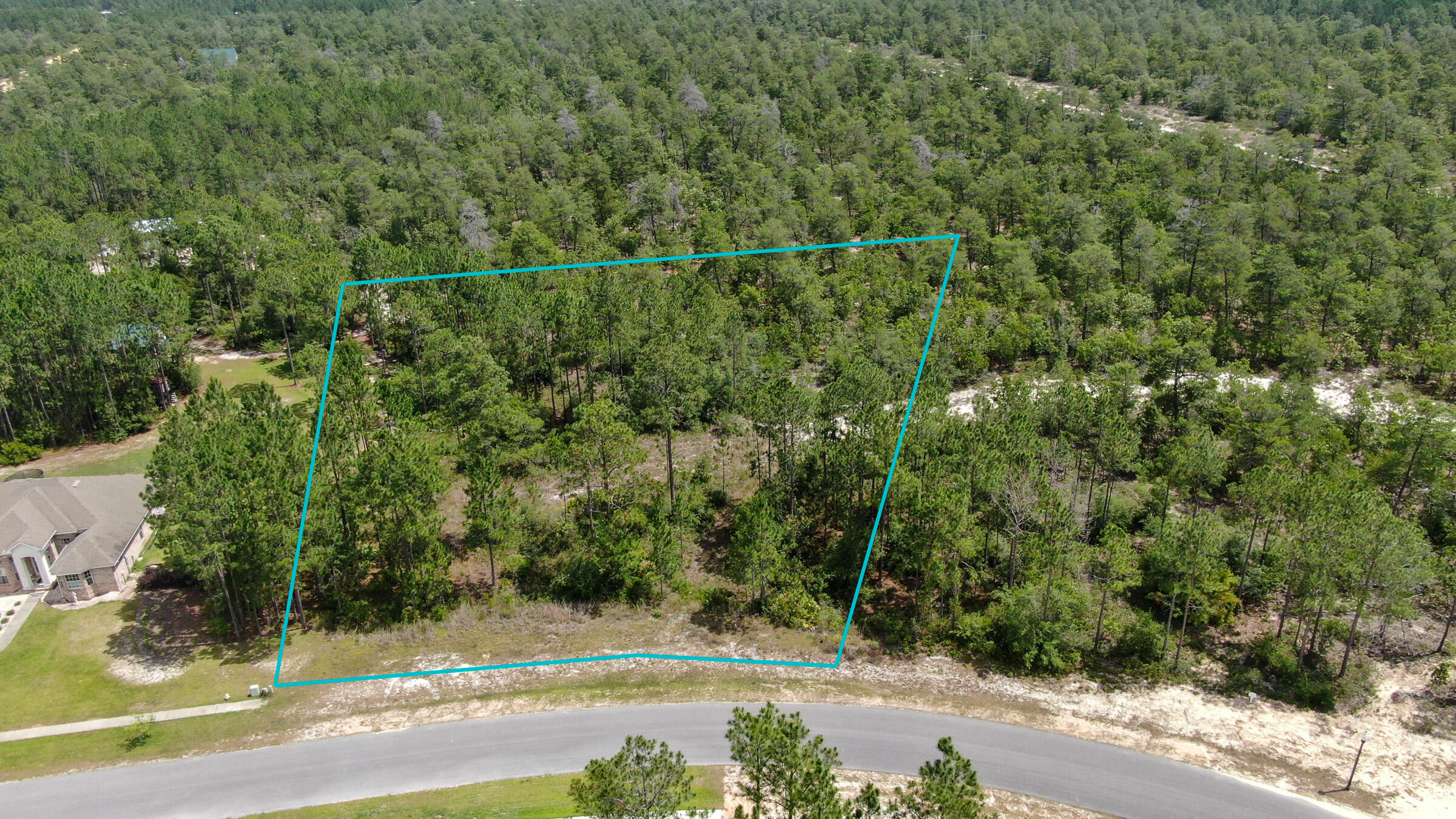 Situated on a 1.75 acre perimeter lot, this beautiful property is a great location to build your custom dream home. Windswept Estates is a 750 acre master-planned residential community and a premier gated golf course. Amenities include a large swimming pool and clubhouse, two tennis courts, basketball courts, and a playground - the perfect place to call ''HOME''.