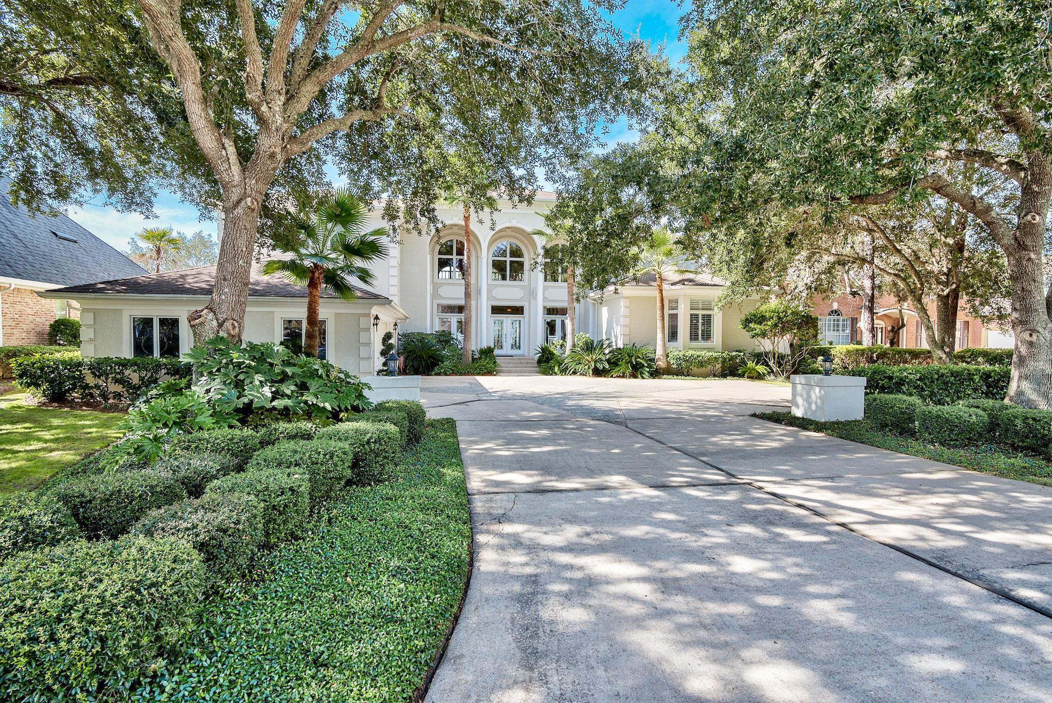 The best views and sunsets on the Choctawhatchee Bay are here at 1363 Windward Lane tucked securely in the gated community of Windward in the coastal community of Bluewater Bay! Live the waterfront Lifestyle in this one of a kind estate, landscaped with mature majestic live oaks, palm trees, and many indigenous plants found in Northwest Florida. With over 6,200 sq ft of luxury living space, 5 bedrooms and 5 bathrooms this home has something for everyone. The grand entrance sets the tone with soaring 22' ceilings as it invites you to the Great room highlighted by the floor to ceiling windows that frame the spectacular views of the Bay. Custom details include white oak flooring, mosaic tile, crown molding, antique chandeliers, two gas fireplaces and much more. The kitchen is well appointed