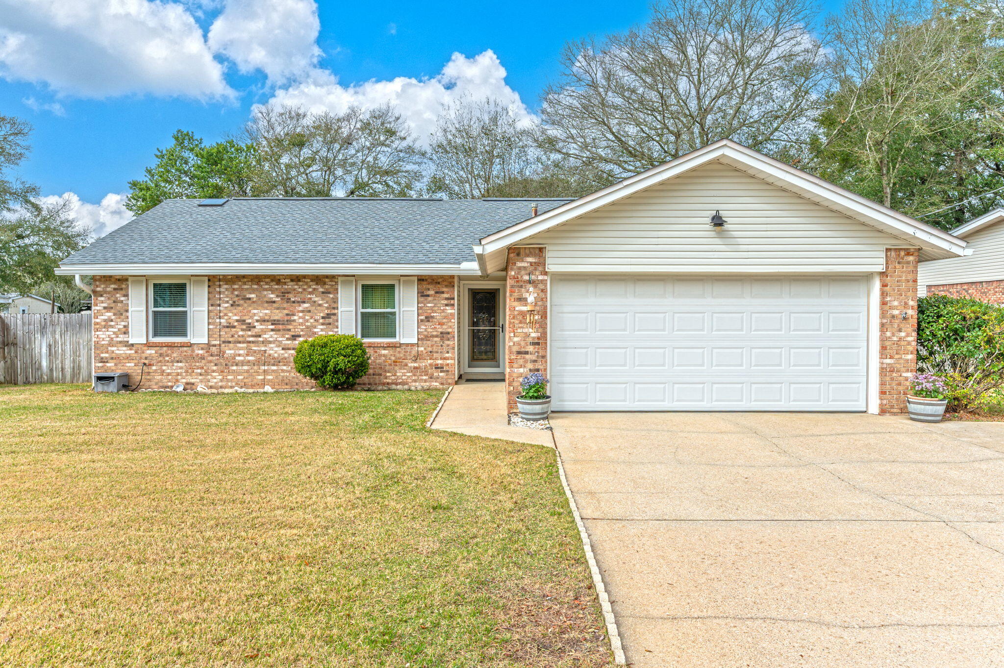 This beautiful well maintained home has some great updates. Roof replaced in 2022. Hot water replaced in 2024. HVAC system replaced in 2025. Pump for sprinkler system replaced in 2024. Seller says it has a deep well. Newer high sitting toilets replace in recent years. Master tub was replaced with a nice sized walk-in shower. Master bedroom is tiled and has a walk-in closet. In addition to the living room with a woodburning fireplace there is a windowed Florida room that is 11.5x21.5. Off the master bedroom is an 11.5x22 screened in porch. This home is neat, clean and well cared for. Refrigerator in the garage does not stay. Buyer to confirm all information and measurements.