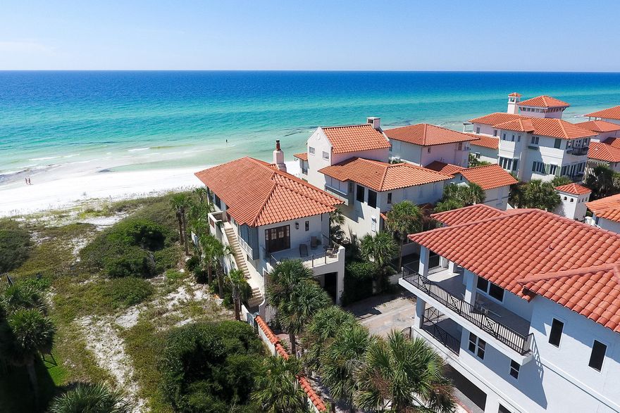This classic Mediterranean home commands attention atop a dune overlooking the Gulf of Mexico. Situated on the farthest eastern end of the Santa Barbara-style gated community of Vizcaya, it boasts very attractive curb appeal with its enviable location. This elegant home abuts a 60' easement on its east side between it and the neighboring property affording incredible eastern views of the shoreline unlike any other Vizcaya homes. Vizcaya is an intimate community featuring 32 homesites with 18 of those being direct gulf front. It is desirable for a high level of exclusivity & privacy and offers a heated community pool with 950' of private beach. Featuring 4 bedrooms and 4 baths, this residence enjoys wonderful sunsets from the balcony both upstairs & down. One of its many comforts is a