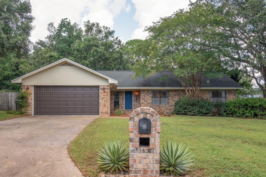 Located in the highly desirable neighborhood of Whisper Way off picturesque Scenic Hwy, this 3/2 home is ready for you to call it home!  Sitting on a large corner lot, this home has a smartly laid floor plan with large living spaces to relax and spend time with friends or family.  The owners installed all new appliances, including a wine cooler, and the formal dining room is perfect as a flex space or home office!  The backyard is it's own private oasis with a screened in porch with a ceiling fan to drive away the Florida heat, a huge deck that is both covered and open, and custom built-in benches.  The yard is equipped with a well-fed sprinkler system and beautiful mature oaks.