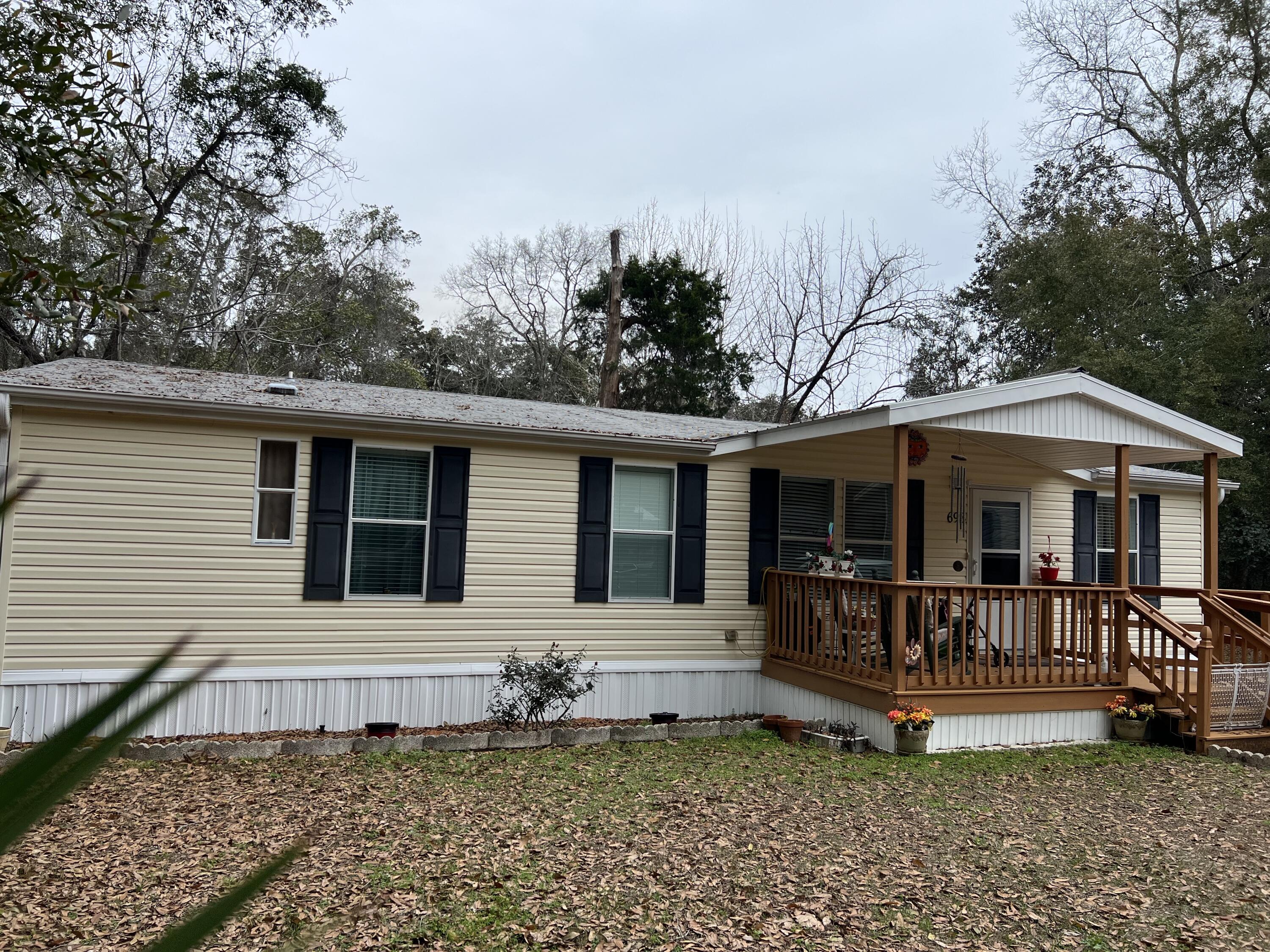 Back on the Market at $10K below appraised value--buyer couldn't obtain financing. Don't miss this one of a kind property! This property features a modular home, an older mobile home w/ added living space & a garage/storage building on a large lot with convenient access to Niceville and Freeport. The primary building is a well-cared for 2009 3/2 mobile home with 1,440 sq ft. It has an open floor plan with a large kitchen with tons of cabinet and counter space. The seller chose this model for the wrap-around kitchen! The older mobile home (1991) conveys as-is with 1396 sq ft but can be a usable living space with minimal improvements. Workshop with attached garage and large carport area. Buyer to verify any information deemed important to include room dimensions and sq ft