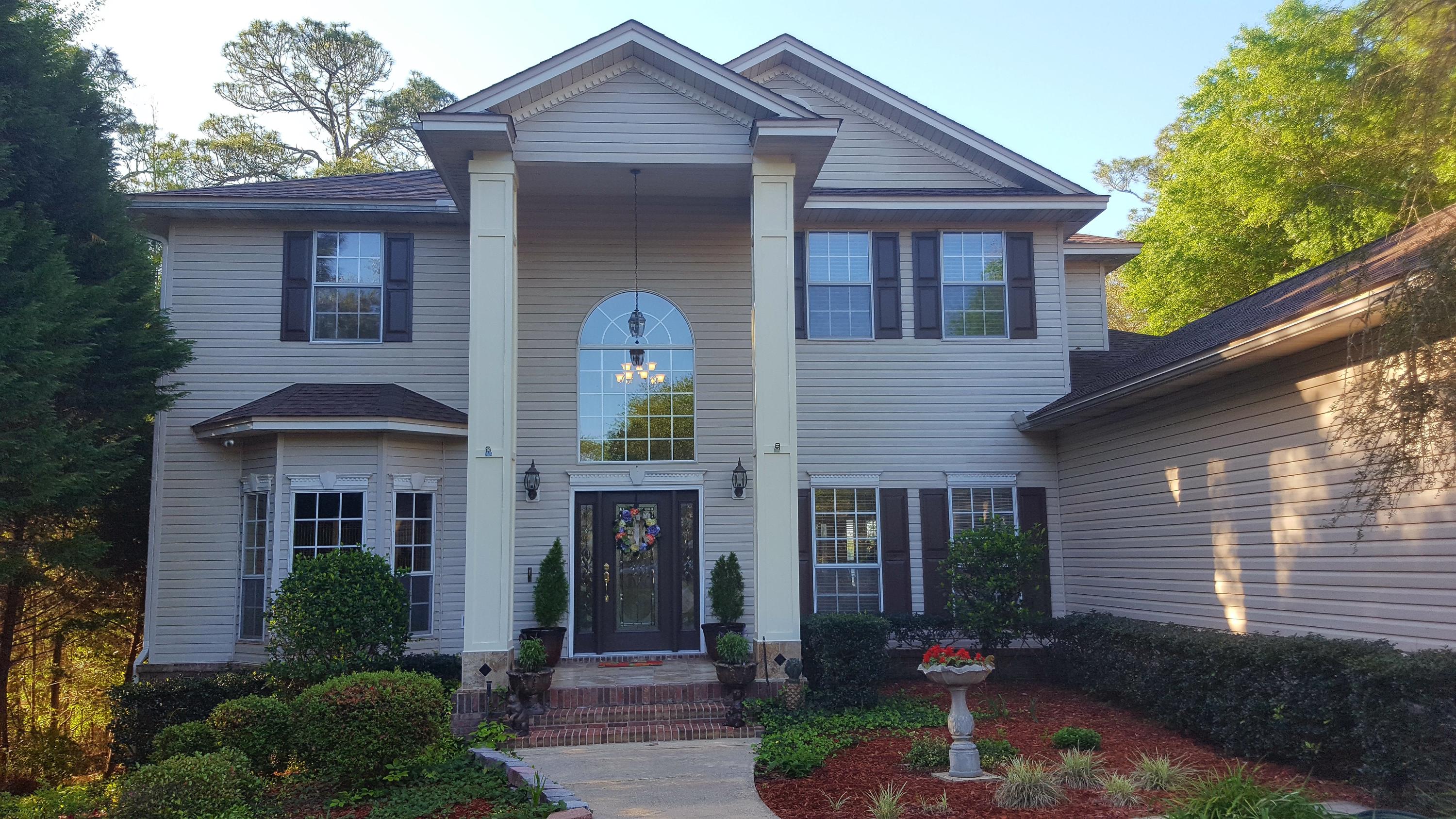 NEW ROOF...BRAND NEW 5 BURNER GAS COOKTOP...AIR CONDITIONERS REPLACED 3 yrs AGO...REMODELED KITCHEN & MASTER BATH...SHOWS LIKE A NEW HOME!It's all about the views, the location, and of course the HOME!!! Yes, you can have it all with this waterfront estate, located only 2 1/2 miles from the new Publix with plenty of shopping nearby! As you drive into this gorgeous property, one is immediately captivated by this classic home situated at the end of a long circular driveway with a flowing fountain surrounded by lush landscaping. This beautiful waterfront estate has 4 bedrooms and 4 FULL baths with an oversized three car garage big enough for a truck and work shop.New roof in 3/16 and new ACs in 5/14 provide lower insurance and electric bills