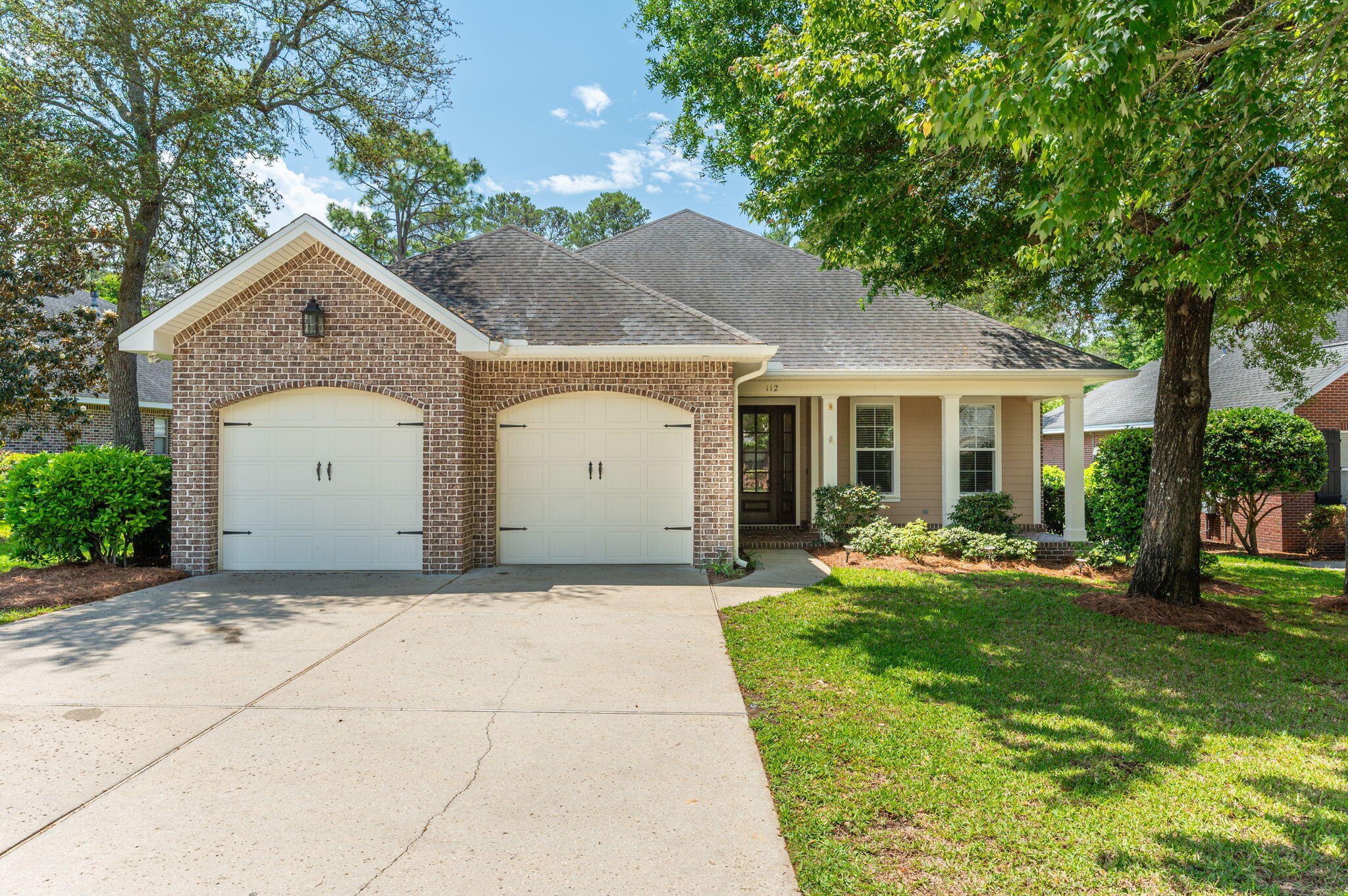 Welcome home to 112 Black Bear Circle, situated on a spacious exterior lot in the Preserve at Swift Creek, a quaint Huff Homes subdivision in Central Niceville. This classic brick home exudes Southern charm all the way from the curb, throughout the well appointed 2300 square feet of living space, and out to the inspired backyard oasis complete with stunning free form POOL, SPA, and integrated FIRE PIT. A gracious covered front porch with herringbone brick floor welcomes visitors to the front door. A cozy foyer gives way to the heart of the home - an open concept living, kitchen, and dining space. 9' ceilings and 8' doors combine with warm, engineered hard wood floors to create an elevated feel. Two bedrooms share a Jack N Jill bathroom to the right of the living room, and a third bedroom, second full bathroom, and laundry room are located off the kitchen toward the garage. The generous primary bedroom suite features an ingenious BONUS DEN that can be closed off behind tall pocket doors or remain open as an extension of the bedroom space. This flexible bonus room can satisfy nearly any need - home office, nursery, gym, reading nook, or just a private retreat. The primary bath offers a RARE garden tub and separate, glass-enclosed shower, double sink vanity with granite counters, and spacious walk in closet. Step out from the living area into a generous screen-enclosed back porch perfect for relaxing year round while overlooking the spectacular backyard. Backyard dreams do come true! An extensive paver patio surrounds this luxury, heated, free form pool and spa. Note the flagstone accents on the pool coping, spa and natural gas fire pit. Waterfalls from both the spa and fire pit add to the serene soundscape. The pool features a high-end pool filter (Smart Pure OxiPro Ozone generator) for exceptional water purity and clarity that is gentle on swimmers' skin and eyes. Beyond the pool deck, enjoy abundant open space for play in the full-fenced yard.
The Preserve at Swift Creek is an intimate subdivision that is perfectly located within minutes of Rocky Bayou Christian School, Ruckel Middle School, Niceville High School, Northwest Florida State College, Twin Cities Hospital, and a short commute to Eglin, Duke, 7th Group, and Hurlburt Field. Jump right onto the 293 bypass and sail directly across the Mid Bay bridge to Destin and the famed white sand beaches of the Emerald Coast.
Updates include:
Pool, spa, fire pit, paver patio 2017
Refrigerator and Dishwasher 2019
Fence replaced 2025
Garbage disposal 2024
Additional Bedroom carpet replaced with vinyl plank flooring 2019
Various HVAC components replaced 2015, 2017, 2019, 2025