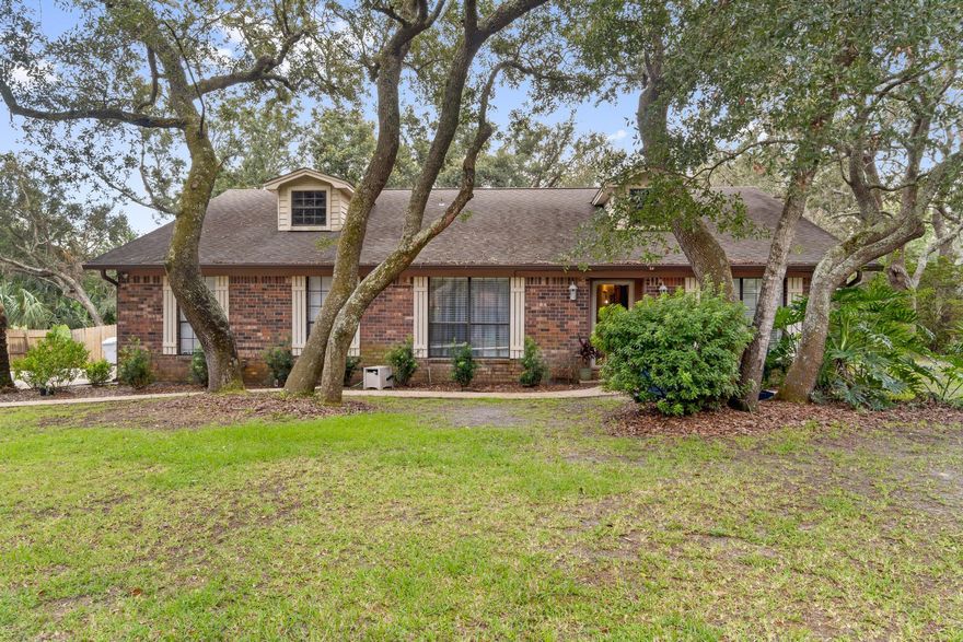 Come look at this just under 2000sqft. home located on quiet cul-de-sac in a desirable neighborhood in Gulf Breeze. Home is lined beautifully with picturesque Oak Trees. Home features wood looking tile flooring and has newer Black Stainless Steel Appliances. Front bonus room boasts gorgeous barn doors as you walk into the front door! It is currently being used as a bedroom but it could be used as an Office/Game Room or as a second Living Room! As you walk further into the home you will see the open concept kitchen/ living area with a Wood Burning Fireplace with built-in bookshelves. Backyard also has a large Shed/Workshop with electricity and a separate smaller shed for additional storage which both will convey as-is. *Seller will replace roof prior to closing with acceptable offer**