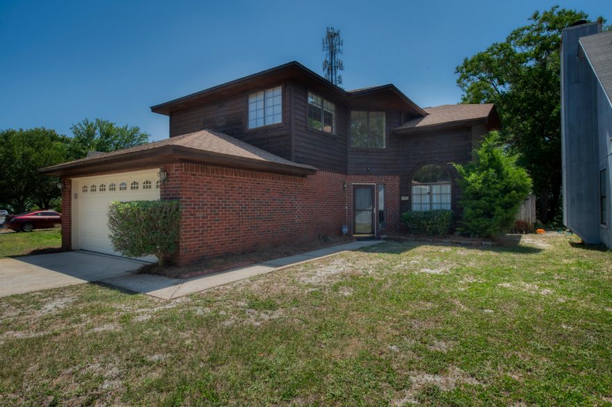 Welcome home to this adorably spacious two story in Mary Esther!This cedar home has been sealed, and features new flooring, some new windows, new sliding glass doors, new carpet, new lighting/fans/ some hardware so you can feel this is move in ready for you!The property is fully fenced and also has a screened patio area for relaxing. This home is conveniently located minutes from Hurlburt Field Base, beaches, shopping and restaurants.The master bedroom is oversized with plenty of natural light. The bedrooms and staircase has new carpet and padding, while the rest of the home features a wood look laminate for a seamless look. The stainless steel appliances convey with the home also! The AC unit had a recent tune up, the garage door is brand new, and the landscaping has been retouch