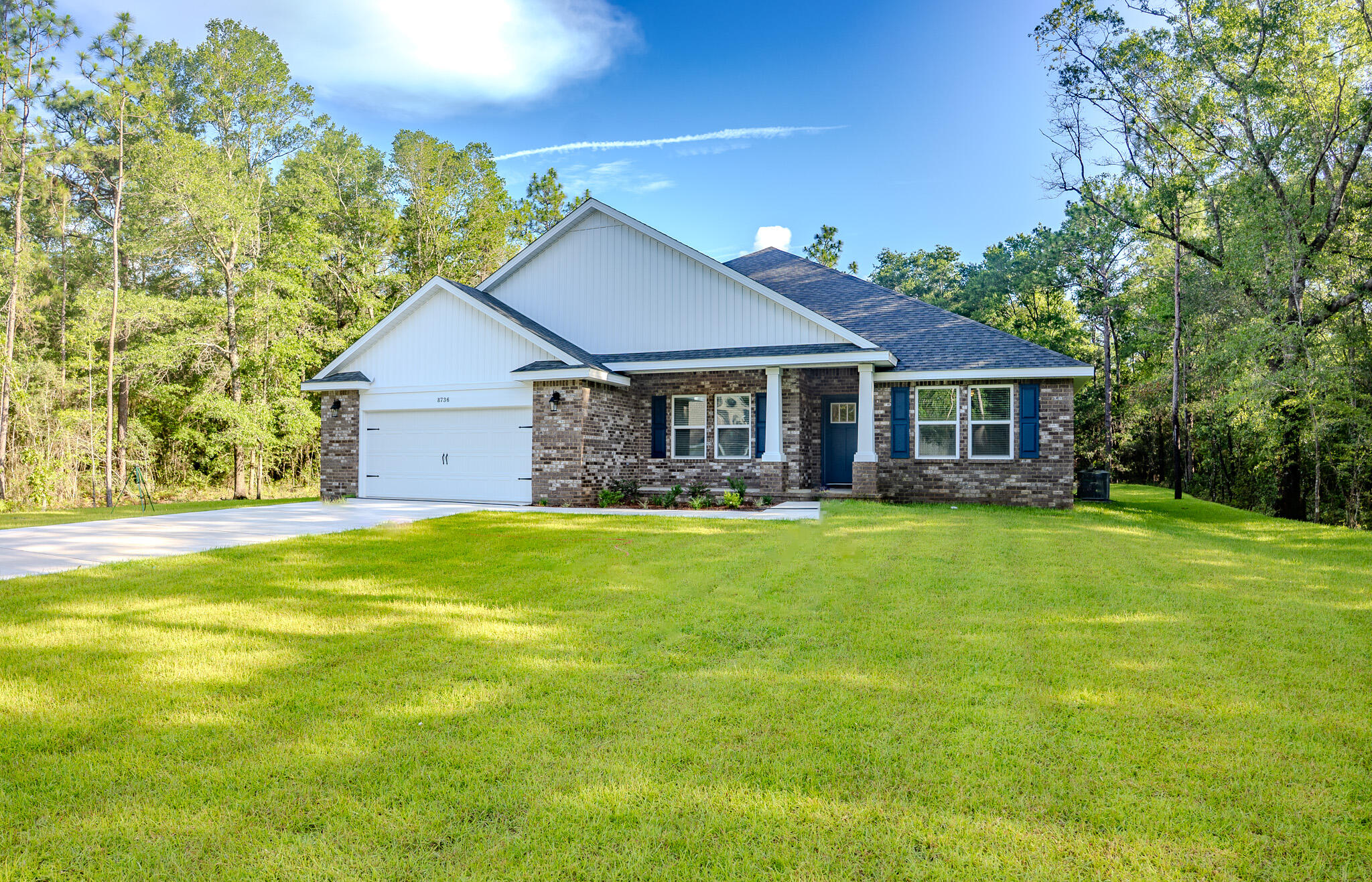 Welcome to Valhalla's Landing and Discover this stunning 5-bedroom, 3-bathroom brick home. Nestled on a secluded 1.29-acre lot for ultimate privacy and outdoor enjoyment. Located on a private road in a highly desirable new subdivision south of I-10, just off Hwy 87, this home offers a perfect blend of modern style, comfort, and convenience.The Turquoise floor plan features an inviting open-concept design, ideal for entertaining and everyday living. The great room seamlessly flows into a chef's kitchen, complete with stainless steel appliances, granite/quartz countertops, under-cabinet lighting, and ample cabinet space. Crown molding in common areas and 2'' faux wood blinds throughout add a touch of elegance.The grand master suite is a true retreat, boasting tray ceilings, dual walk-in closets, and a spa-like en-suite bathroom with a garden tub and separate tiled shower with dual showerheads. A private guest suite with its own full bath makes this home perfect for hosting family and friends.
Enjoy the serene outdoor space with plenty of room for relaxation and recreation. Plus, you're just 20 minutes from Navarre Beach, allowing you to experience the best of coastal living while maintaining privacy and space.
Projected completion: June 2025. Photos are of a similar home; colors and selections may vary.
Prime Location:
-Quick access to Navarre & Milton
-South of I-10 for an easy commute
-Minutes from shopping, dining, and top-rated schools
Don't miss out on this incredible opportunity!