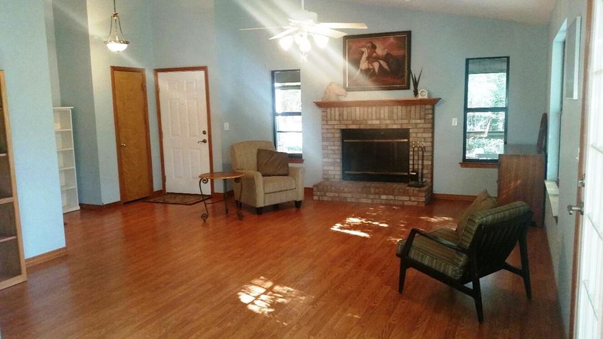 This quiet and secluded house is a nature lovers paradise nestled in lush surroundings on a Beaver Dam lake. It features a step-down into the open living, dining and kitchen areas with vaulted and raised ceilings. Spacious living room features a wood burning fireplace and natural light floods the room. Kitchen has solid oak cabinets, garden window, corian counter tops and tile back-splash. Dining room boast a wonderful bay window and lighted built in china cabinet. Master bedroom is large with vaulted ceiling and features an en suite with walk in shower and walk-in closet. The exterior has 2 open decks and a large screened porch. Relax and enjoy the bird songs and listen to the water trickle in your own back yard. 30 year warranted roof was replaced 12/2012. A/C was replaced 6/2012.