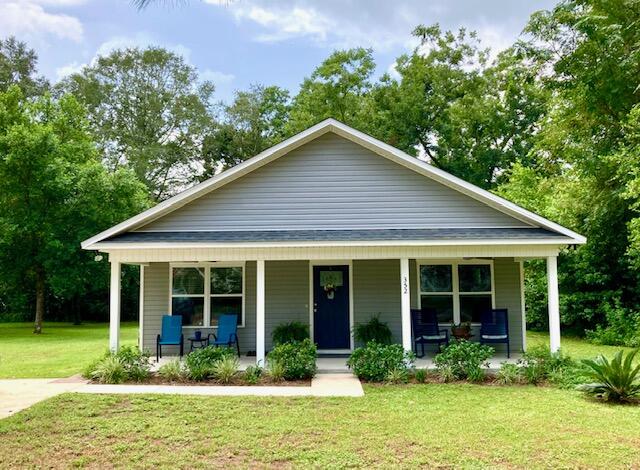 BEAUTIFUL NEWER HOME IN THE LAKEYARD--Just what you have been waiting for! One owner 3BR 2 BA immaculate home built in 2018 and only 2 blocks from Lake DeFuniak! This home features an open living space w/ combo Kitchen, Dining Room, & Living Room. Kitchen has stainless appliances, pantry, and breakfast bar/island. A laundry, 3 spacious bedrooms and a full bath with tub/shower combo open off the hallway. Big Primary Bedroom has carpeted floor, Primary Bath with double vanity and huge walk-in closet. Outdoor living reigns supreme with a front porch, a full screened-in back porch, and paved patio complete with hot-tub. The lot is level with a garden shed and private back yard. Newer construction in our small historic town is hard to find, and just 25 miles from our Gulf beaches! Act fast!