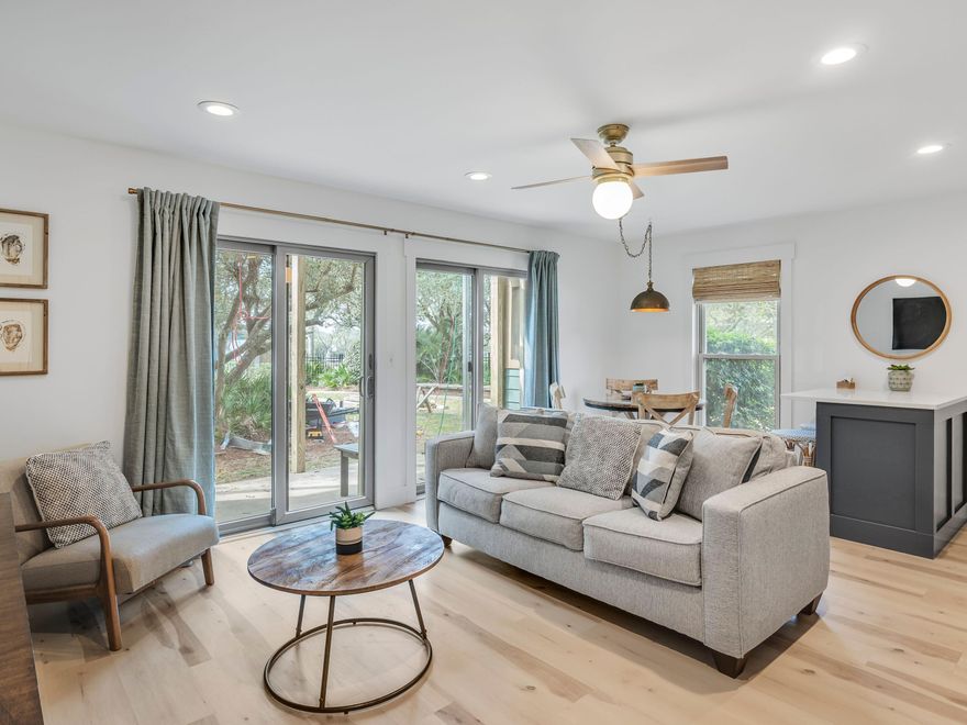 You can't get closer to the beach and pool than this completely updated first-floor condo at Inlet Dunes. As a corner unit, it has the added advantage of an extra side window lighting up the dining area within the open-concept living space. Two sets of sliding doors provide step-free access to the private terrace. It's a lovely space for reading and relaxing with views of mature trees and greenery. The newly refurbished kitchen area has a subway tile wall, clean white cabinets and a full range of stainless steel appliances to cater to every need. There's even a small peninsula breakfast bar with stools for enjoying the most important meal of the day. The unit is designed to comfortably sleep up to four guests with a stylishly decorated bedroom with a king-sized bed and built-in bunks.