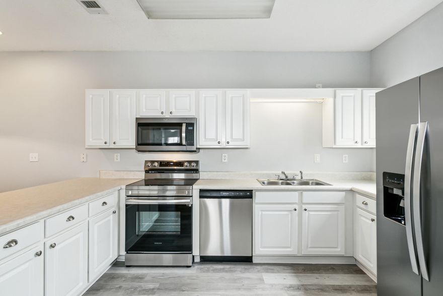 This recently upgraded unit has new appliances, flooring, and water heater, ensuring comfort and efficiency. Upon entering, you'll be greeted by two bedrooms located towards the front of the condo, with a convenient hall bath that also connects to the second bedroom, making it easily accessible for guests or family members. The primary bedroom features a spacious closet and an ensuite bath, providing privacy and convenience. The open living area flows seamlessly onto a relaxing patio, perfect for enjoying the outdoors. Additionally, there's a storage closet off the patio, ideal for storing your pool floats and other items neatly. Living in this condo offers numerous advantages thanks to the HOA amenities, which include water, sewer, and garbage services, as well as a community pool.